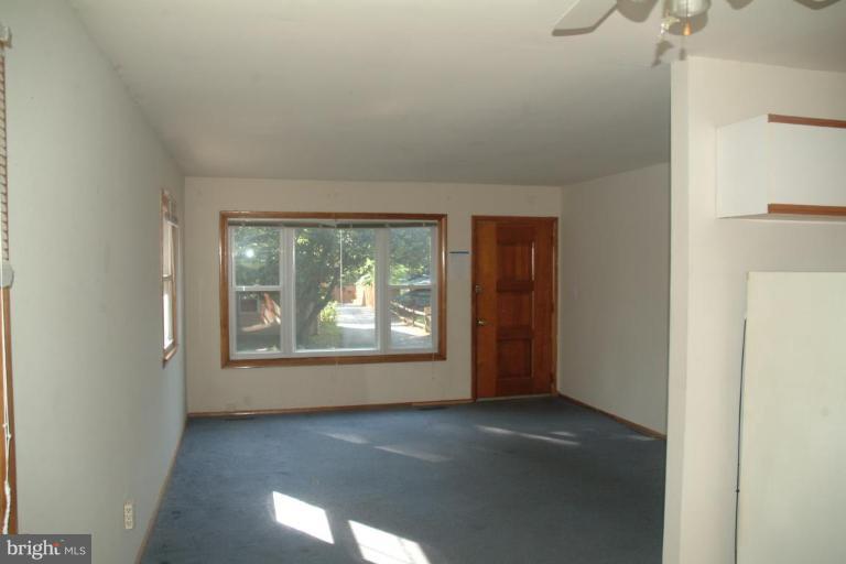 5808 Meridale Road Catonsville, MD 21228 - Photo 4 of 9 a view of an empty room with a window