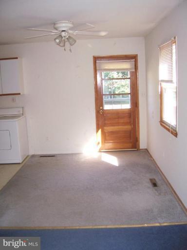 5808 Meridale Road Catonsville, MD 21228 - Photo 8 of 9 an empty room with windows