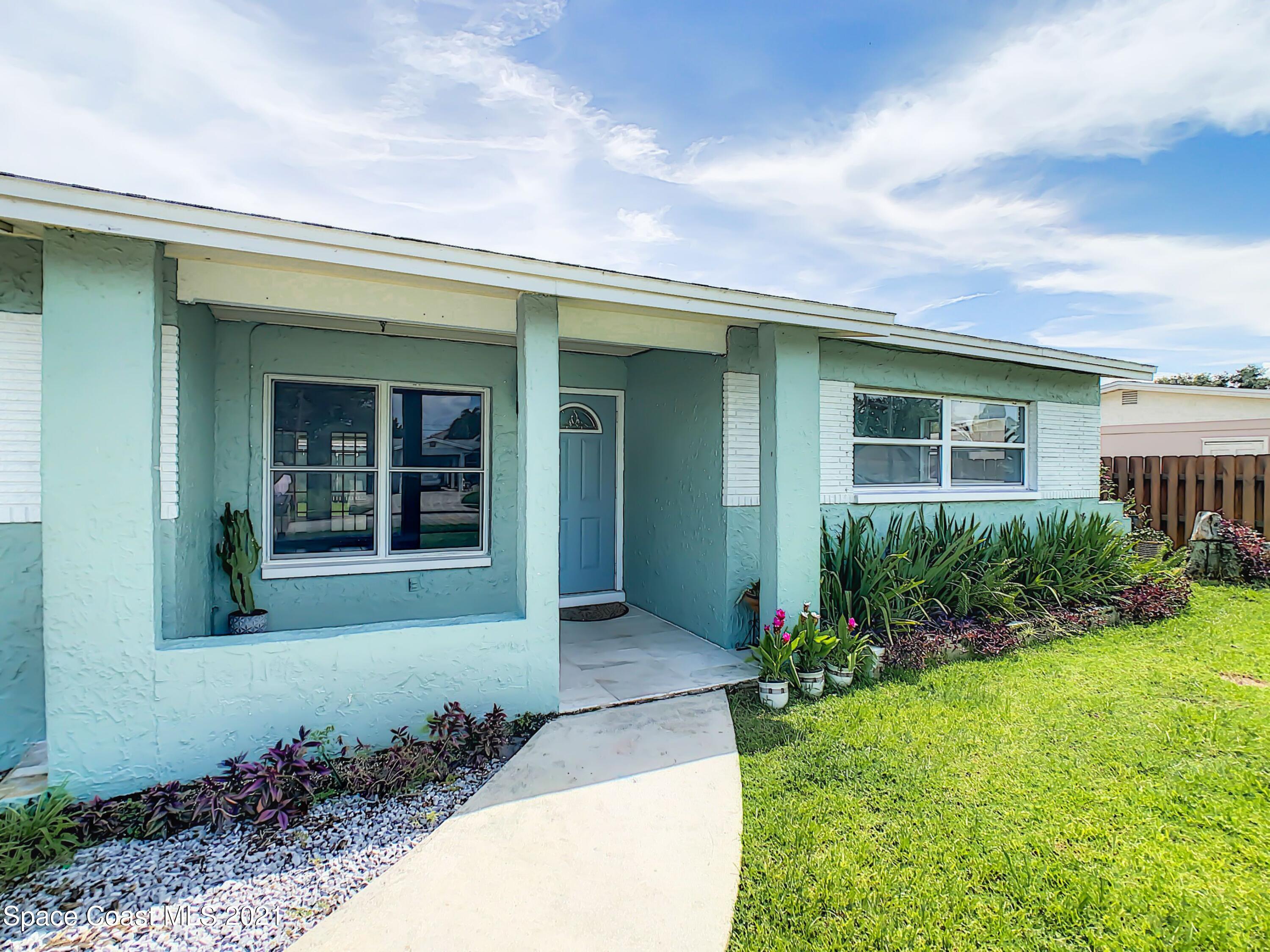 1091 Madrid Road Rockledge, FL 32955 - Photo 1 of 33 a front view of a house with a yard