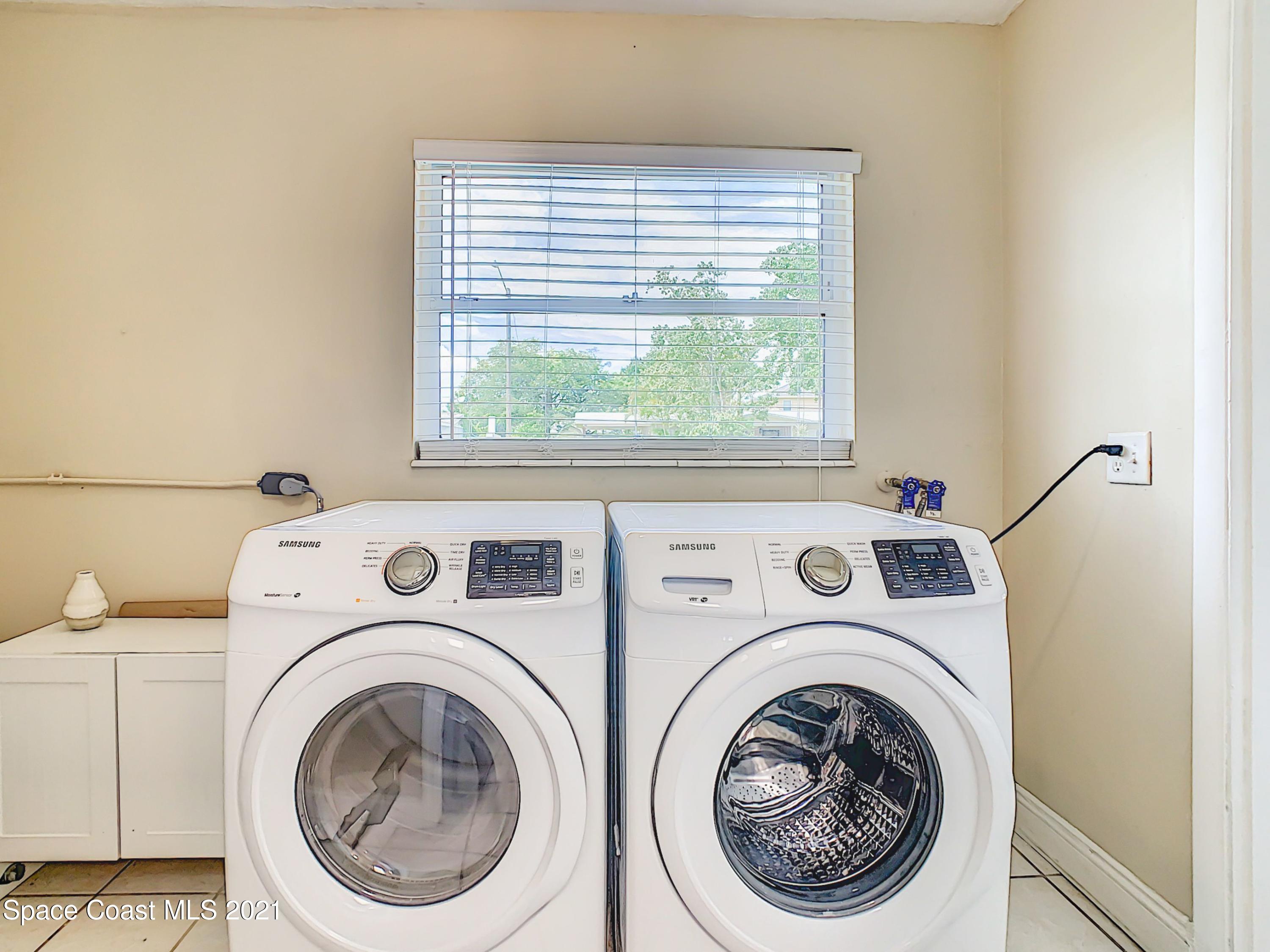 1091 Madrid Road Rockledge, FL 32955 - Photo 16 of 33 a utility room with dryer and washer