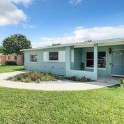 1091 Madrid Road Rockledge, FL 32955 - Photo 3 of 33 a view of house with yard and swimming pool