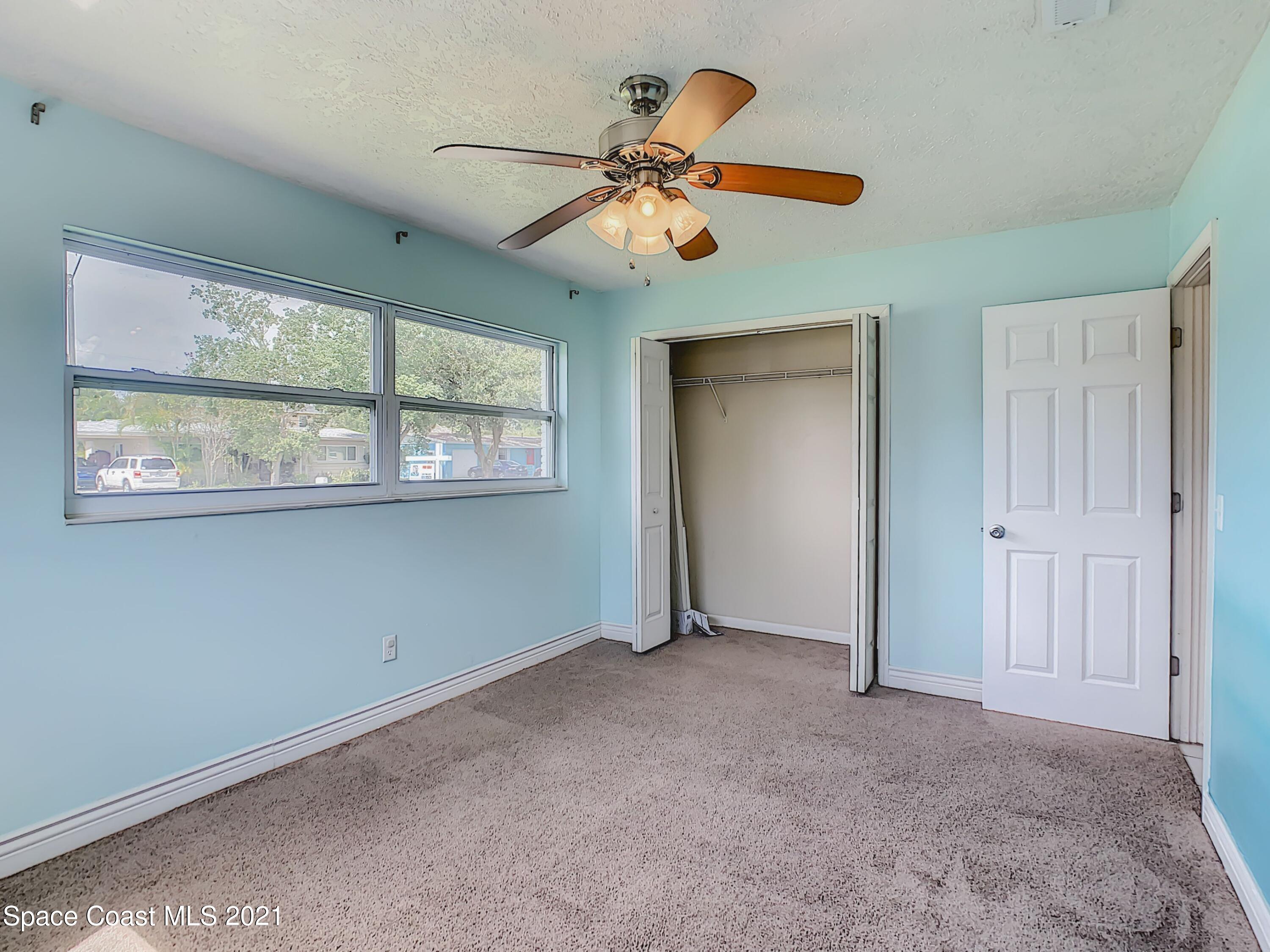 1091 Madrid Road Rockledge, FL 32955 - Photo 23 of 33 a view of an empty room with a window