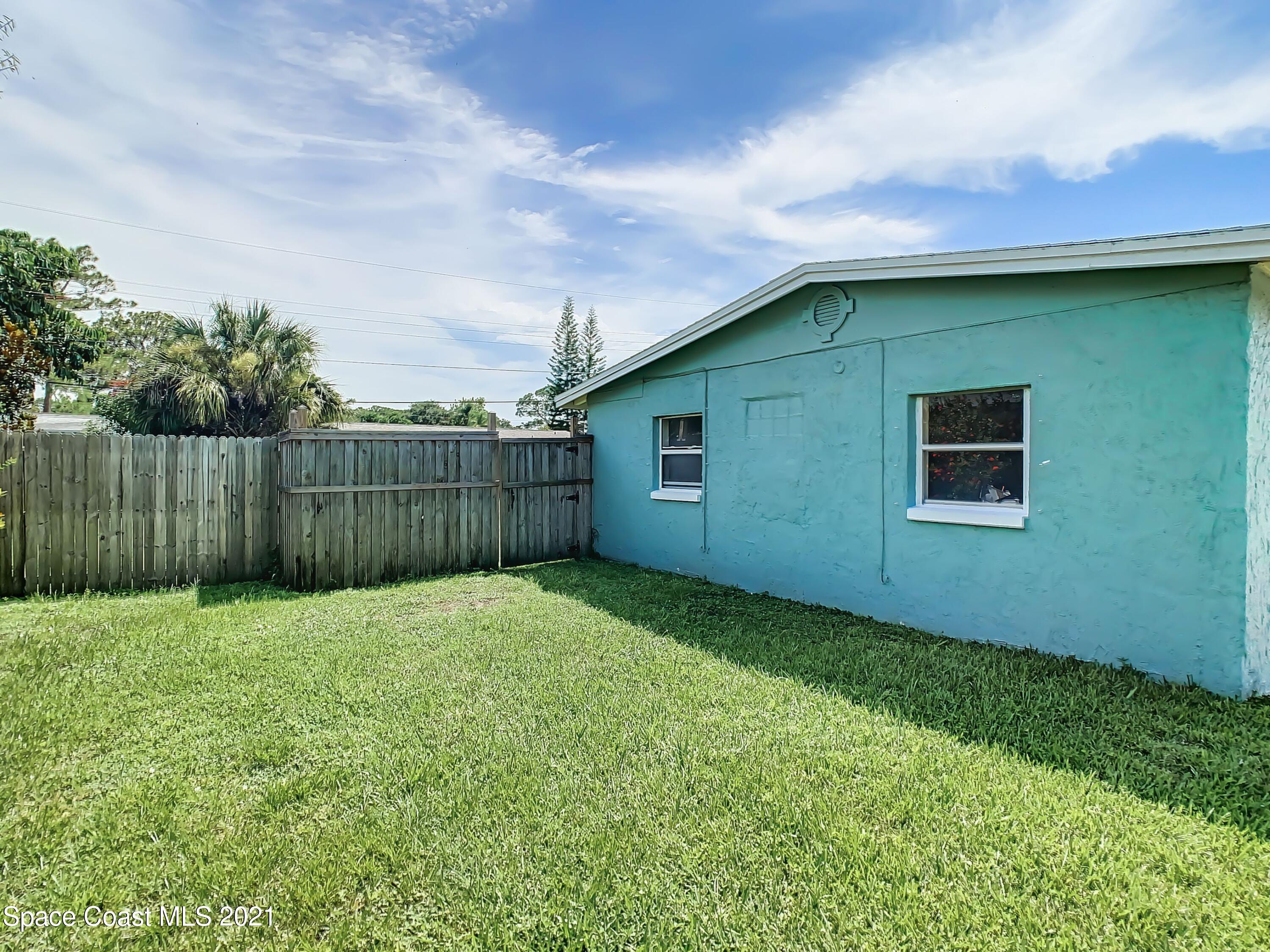 1091 Madrid Road Rockledge, FL 32955 - Photo 25 of 33 a view of a backyard
