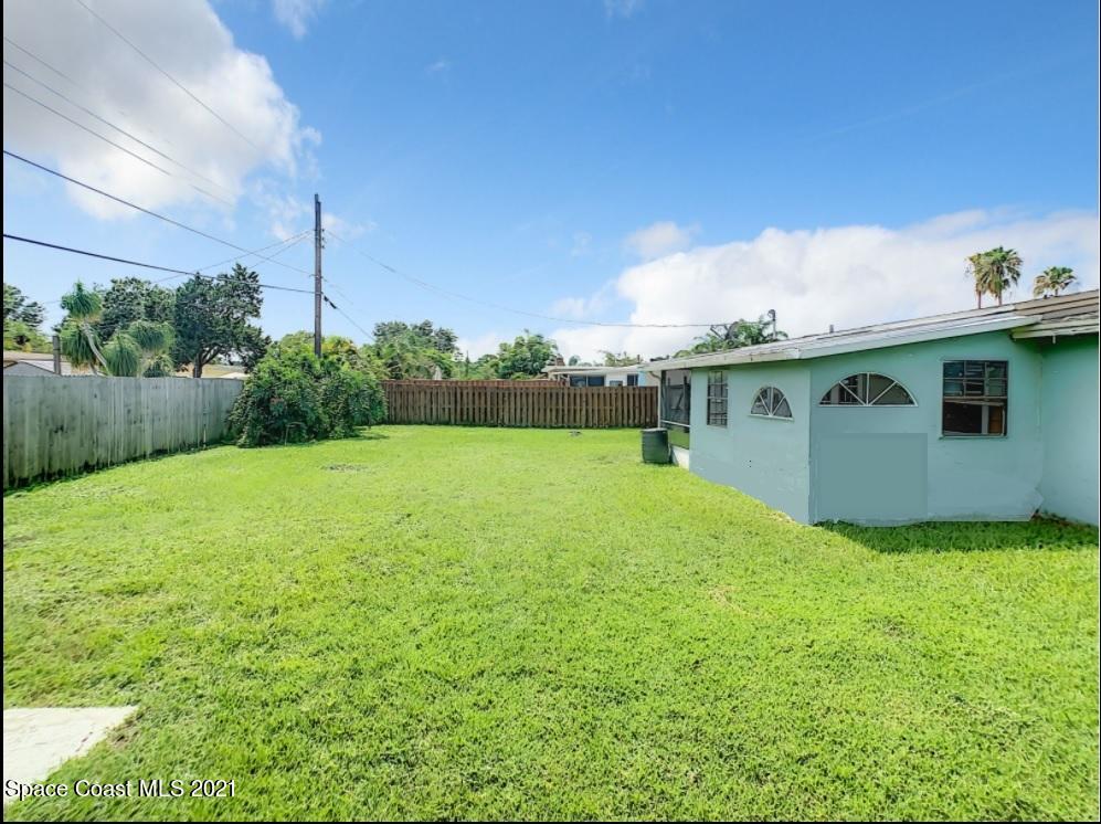 1091 Madrid Road Rockledge, FL 32955 - Photo 27 of 33 a view of a house with backyard and garden