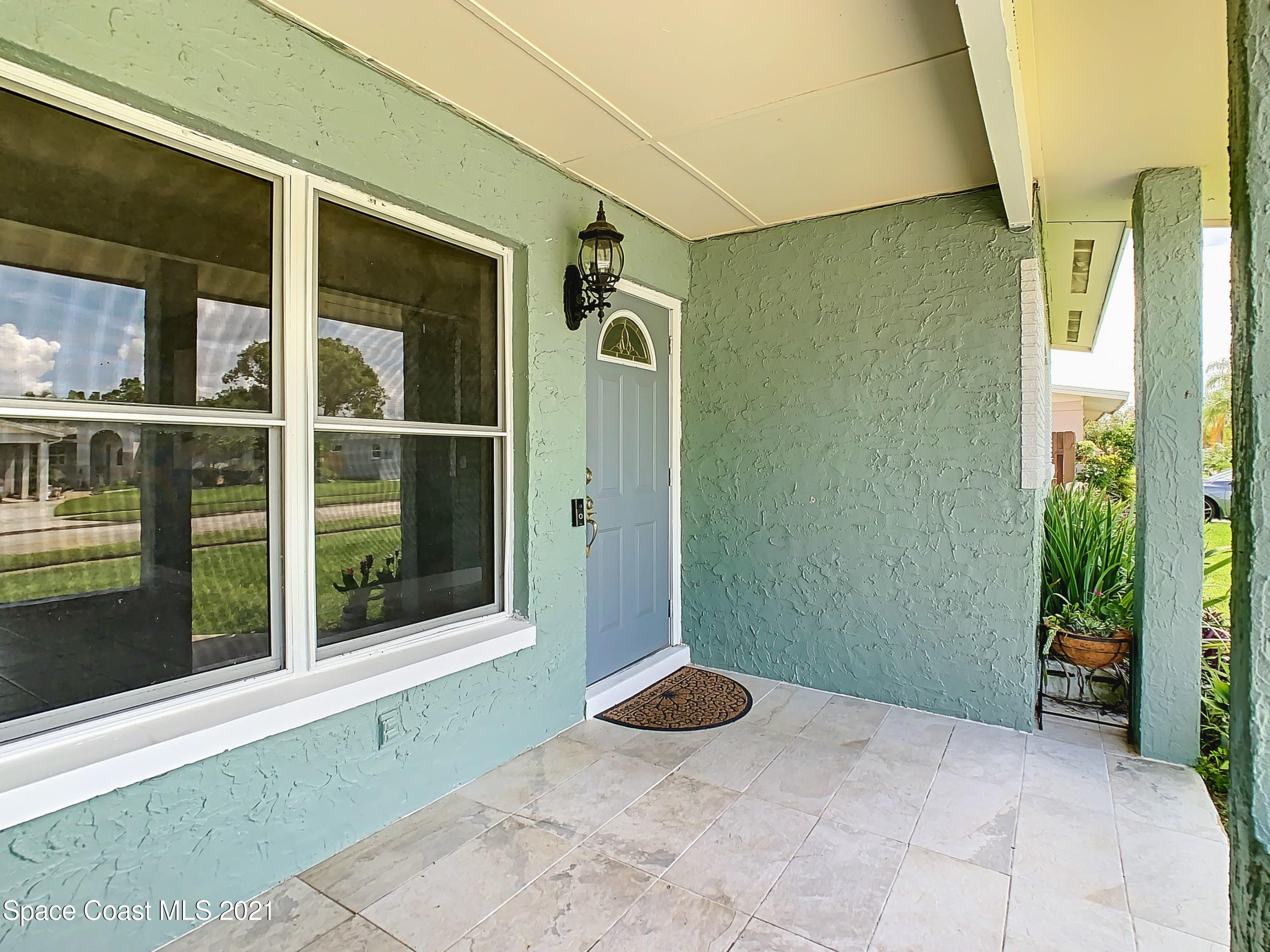 1091 Madrid Road Rockledge, FL 32955 - Photo 4 of 33 a view of a front door