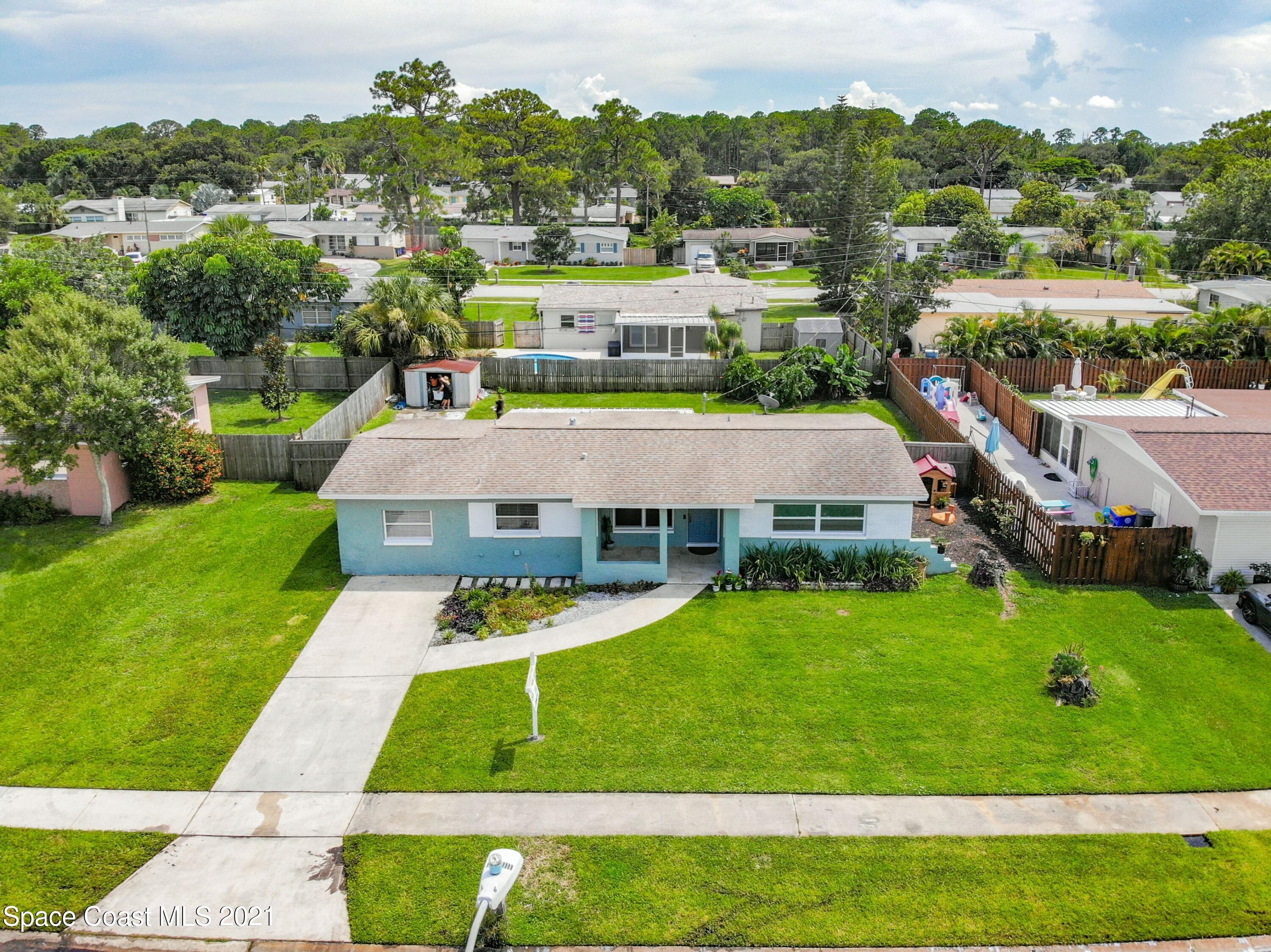 1091 Madrid Road Rockledge, FL 32955 - Photo 29 of 33 an aerial view of a house with a yard
