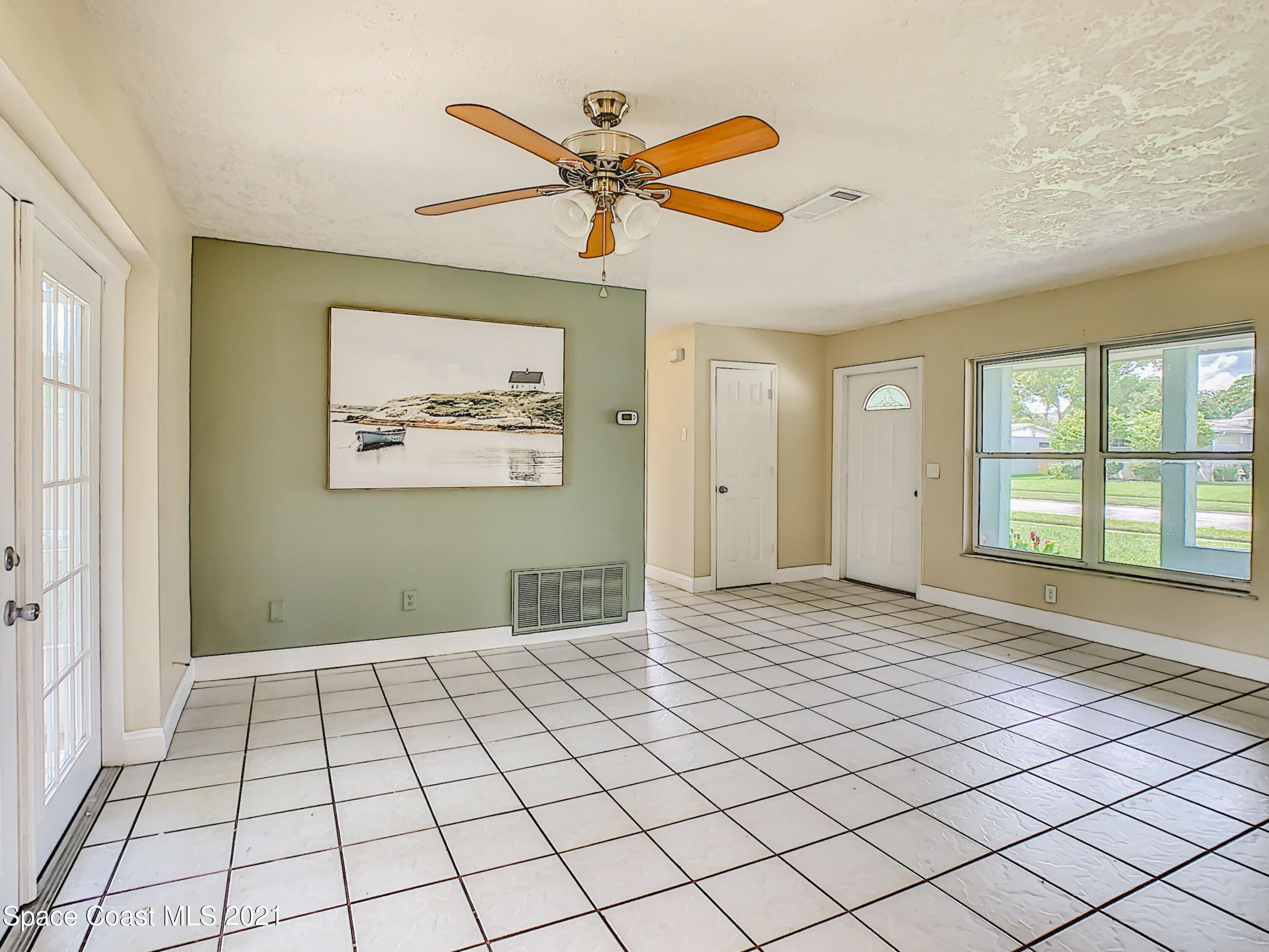 1091 Madrid Road Rockledge, FL 32955 - Photo 6 of 33 a view of an empty room and window