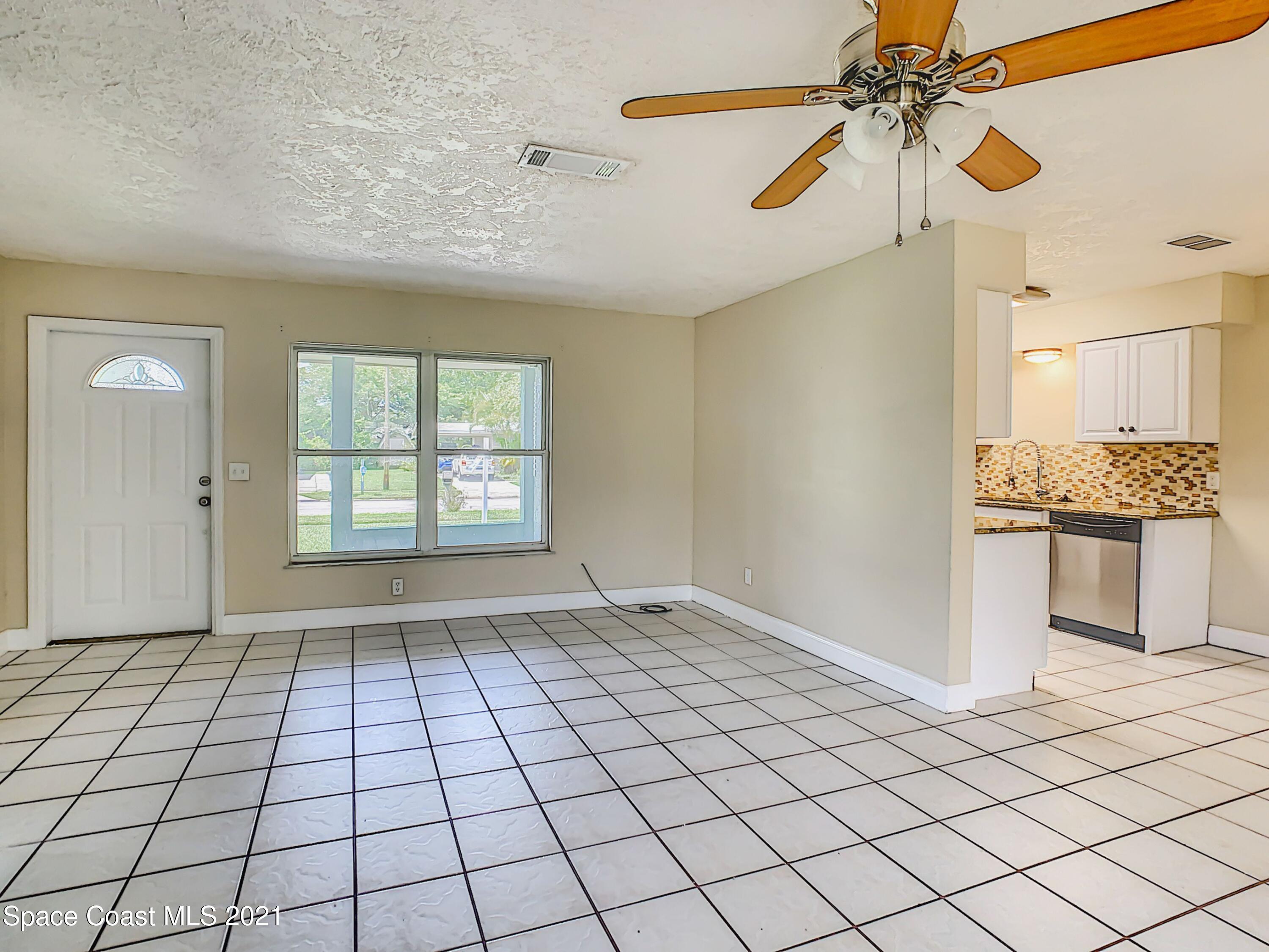 1091 Madrid Road Rockledge, FL 32955 - Photo 10 of 33 a view of an empty room and window