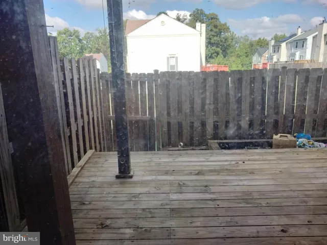 a view of a door with wooden fence