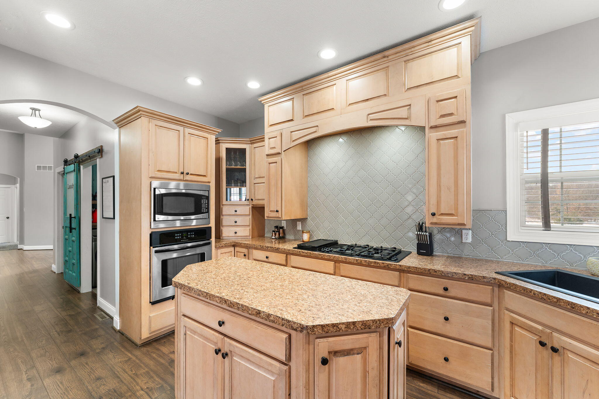 6776 Fox Crossing Knox, IN 46534 - Photo 11 of 53 a kitchen with a sink stove and refrigerator