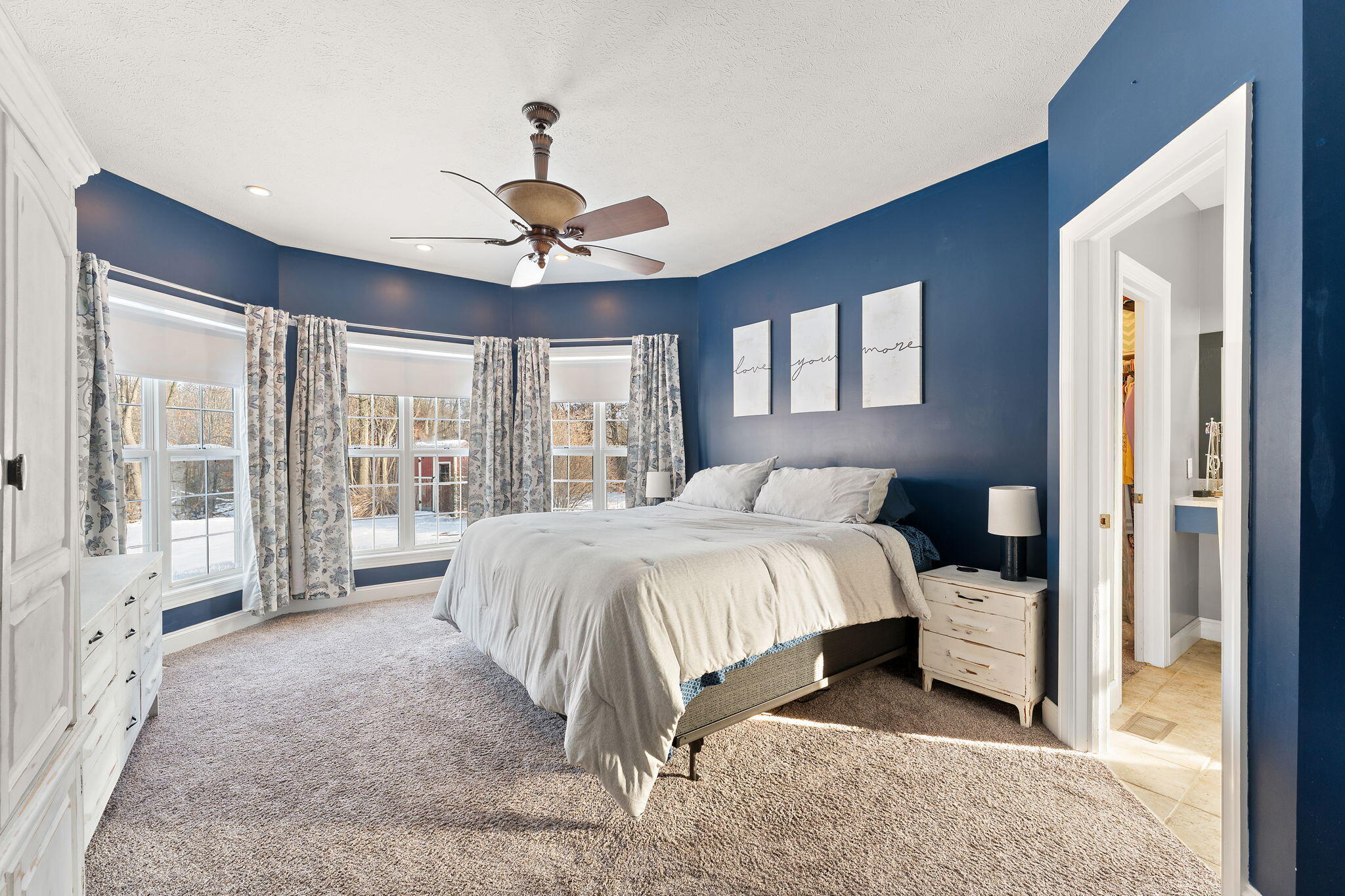 6776 Fox Crossing Knox, IN 46534 - Photo 19 of 53 a spacious bedroom with a bed and a large window