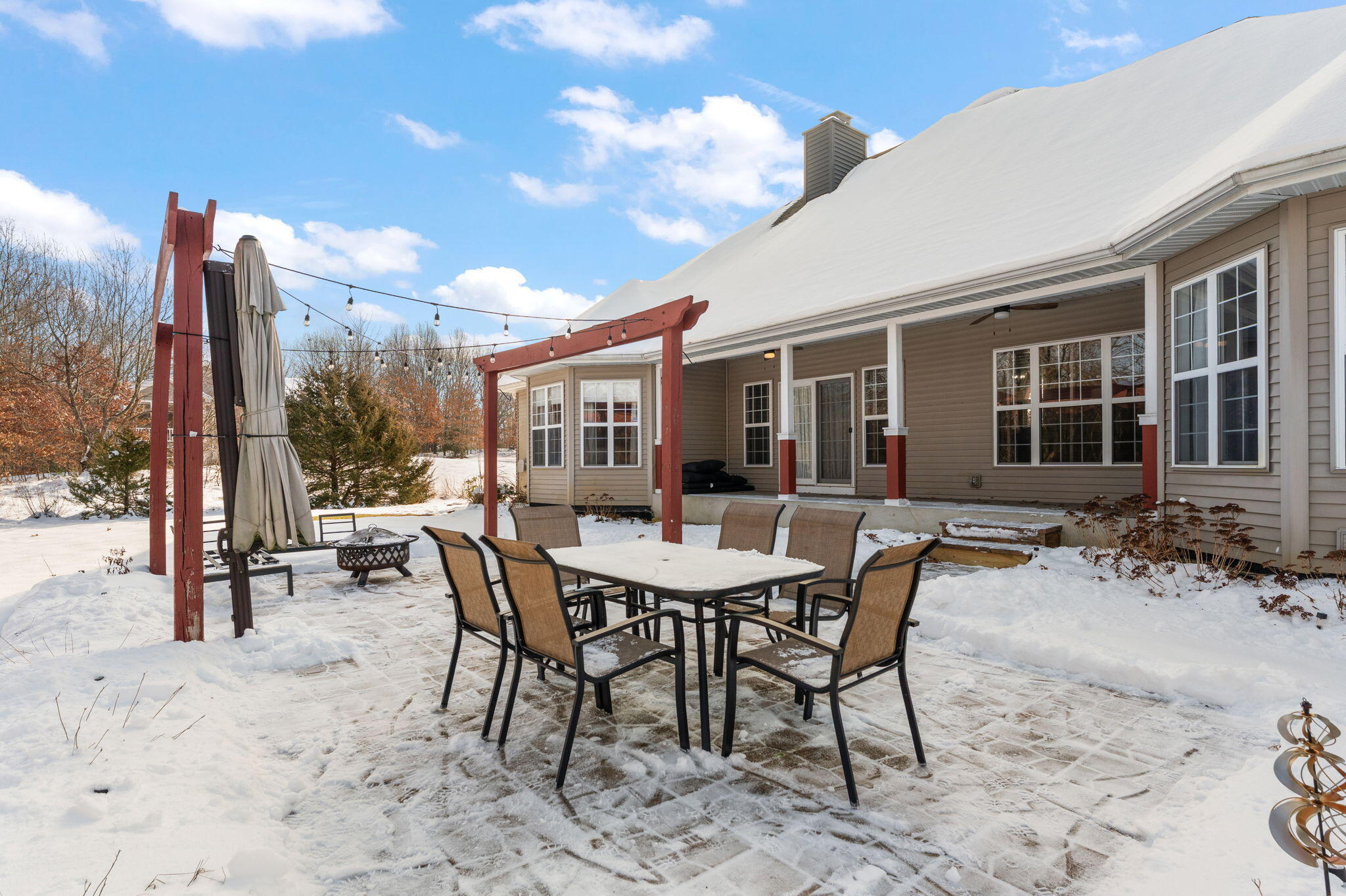 6776 Fox Crossing Knox, IN 46534 - Photo 42 of 53 a view of a dinning table and chairs in the patio