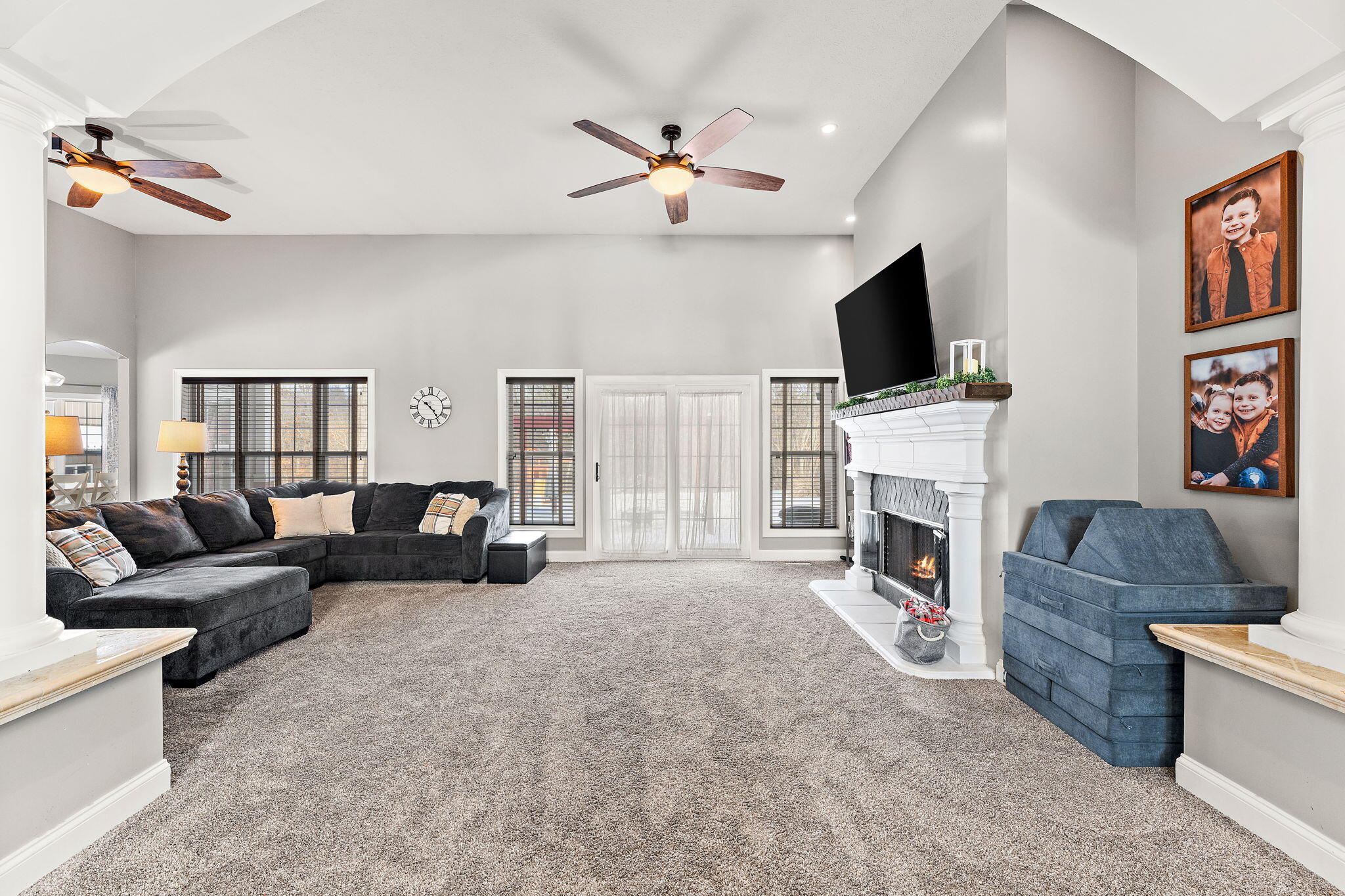 6776 Fox Crossing Knox, IN 46534 - Photo 6 of 53 a living room with furniture a fireplace and a flat screen tv