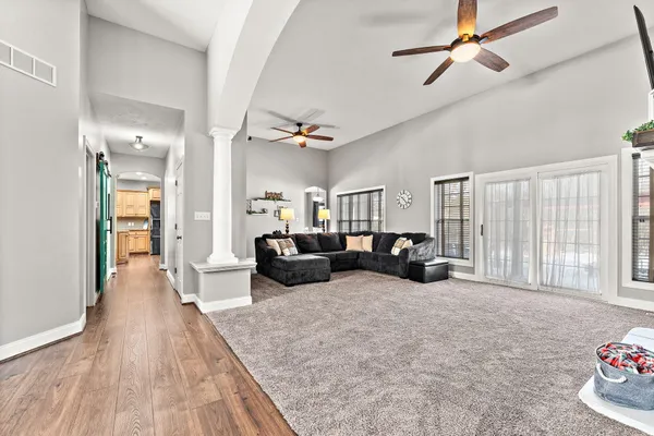 a living room with furniture window and wooden floor