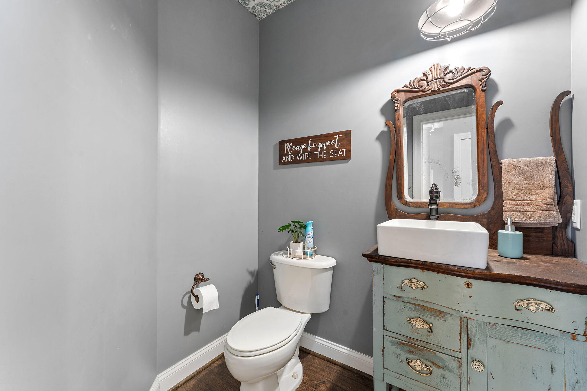 6776 Fox Crossing Knox, IN 46534 - Photo 10 of 53 a bathroom with a toilet a sink and mirror