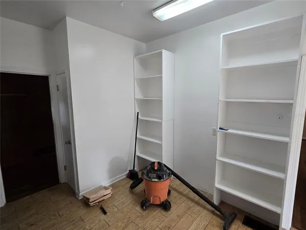 a room with toys and wooden floor