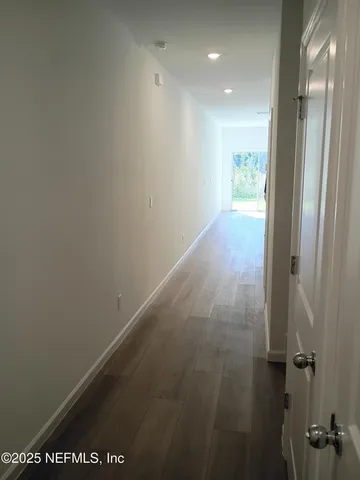 a view of hallway with shower