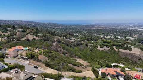 an aerial view of residential house and outdoor space