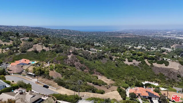 an aerial view of residential house and outdoor space