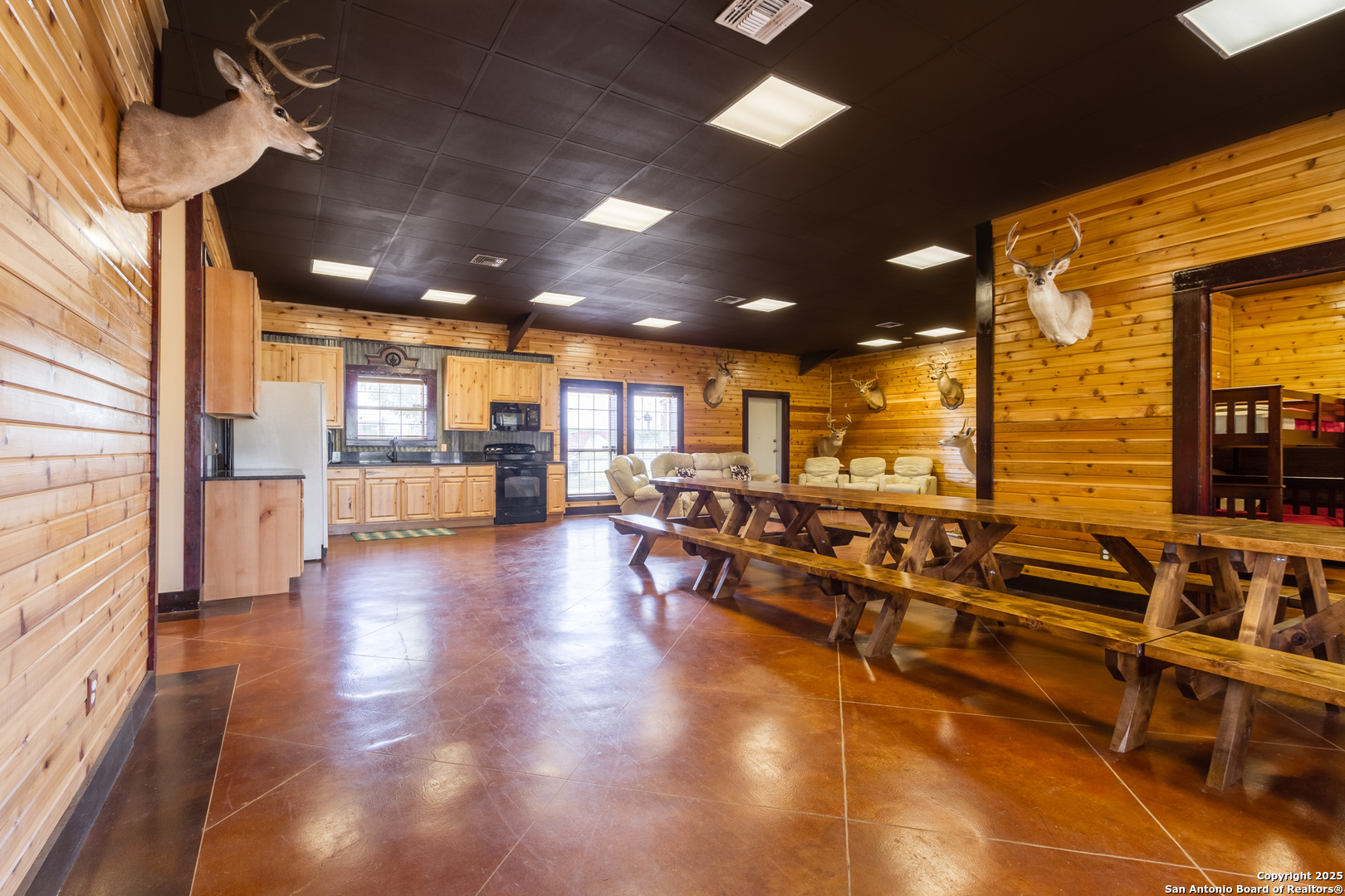 20250 Interstate 35 Access Road Lytle, TX 78052 - Photo 13 of 48 a view of a living room with kitchen view and appliances