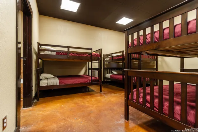 a bedroom with furniture and a window