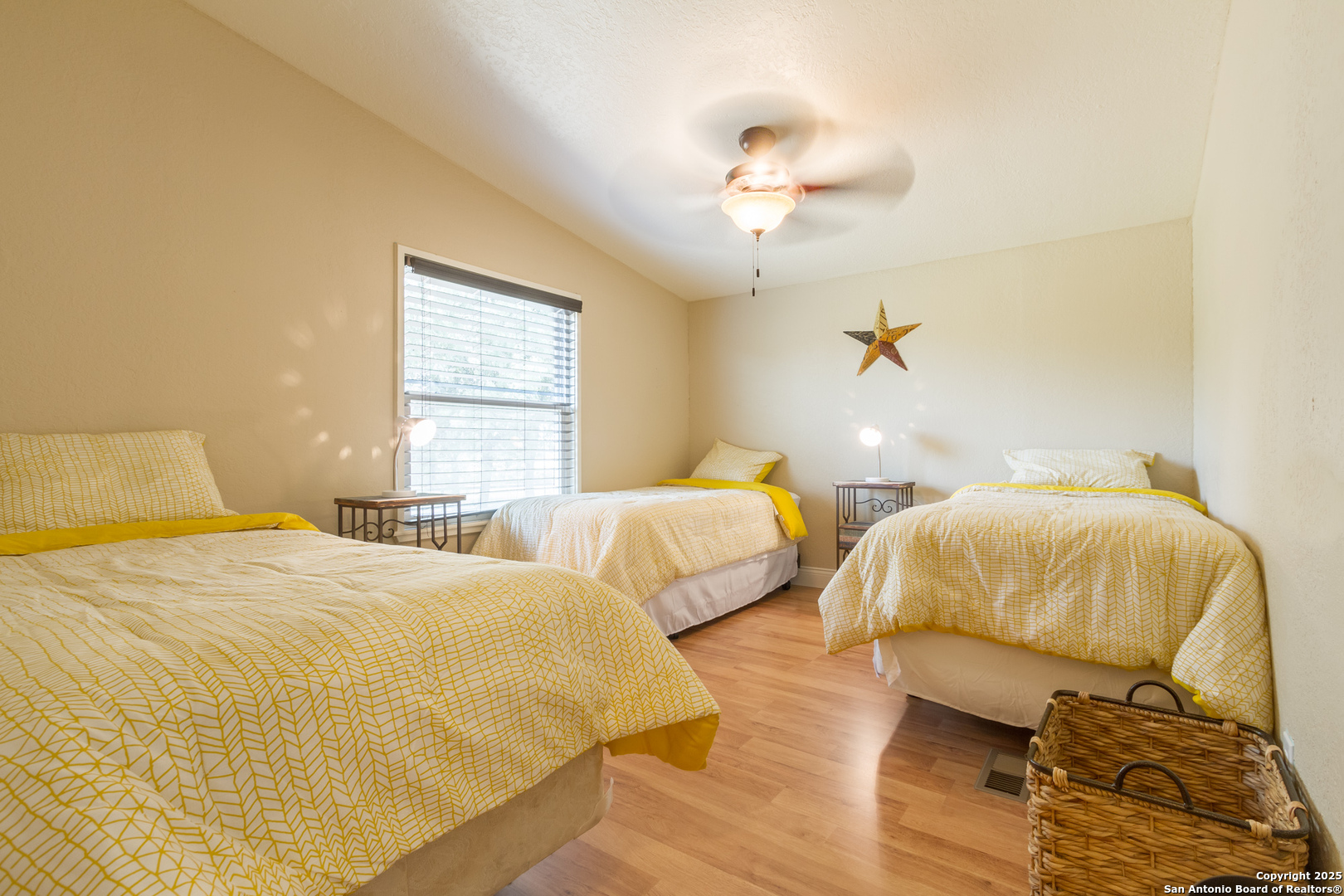 20250 Interstate 35 Access Road Lytle, TX 78052 - Photo 24 of 48 a bedroom with two beds and lamps
