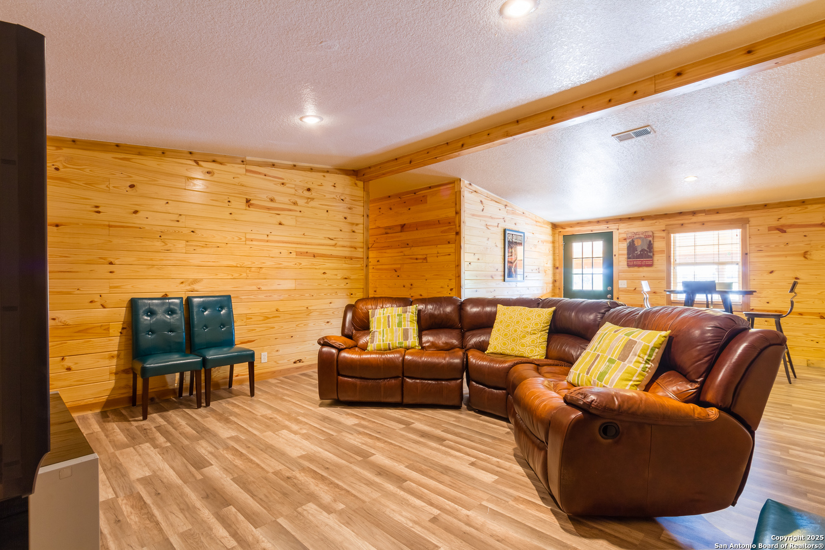 20250 Interstate 35 Access Road Lytle, TX 78052 - Photo 30 of 48 a living room with furniture wooden floor and a large window