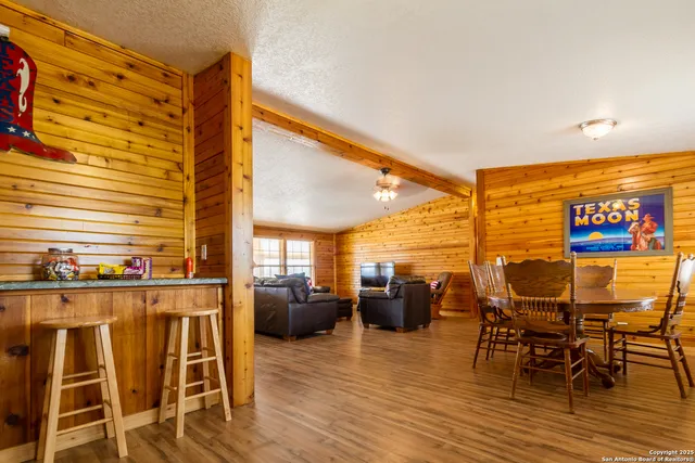a view of dinning table and chairs in patio