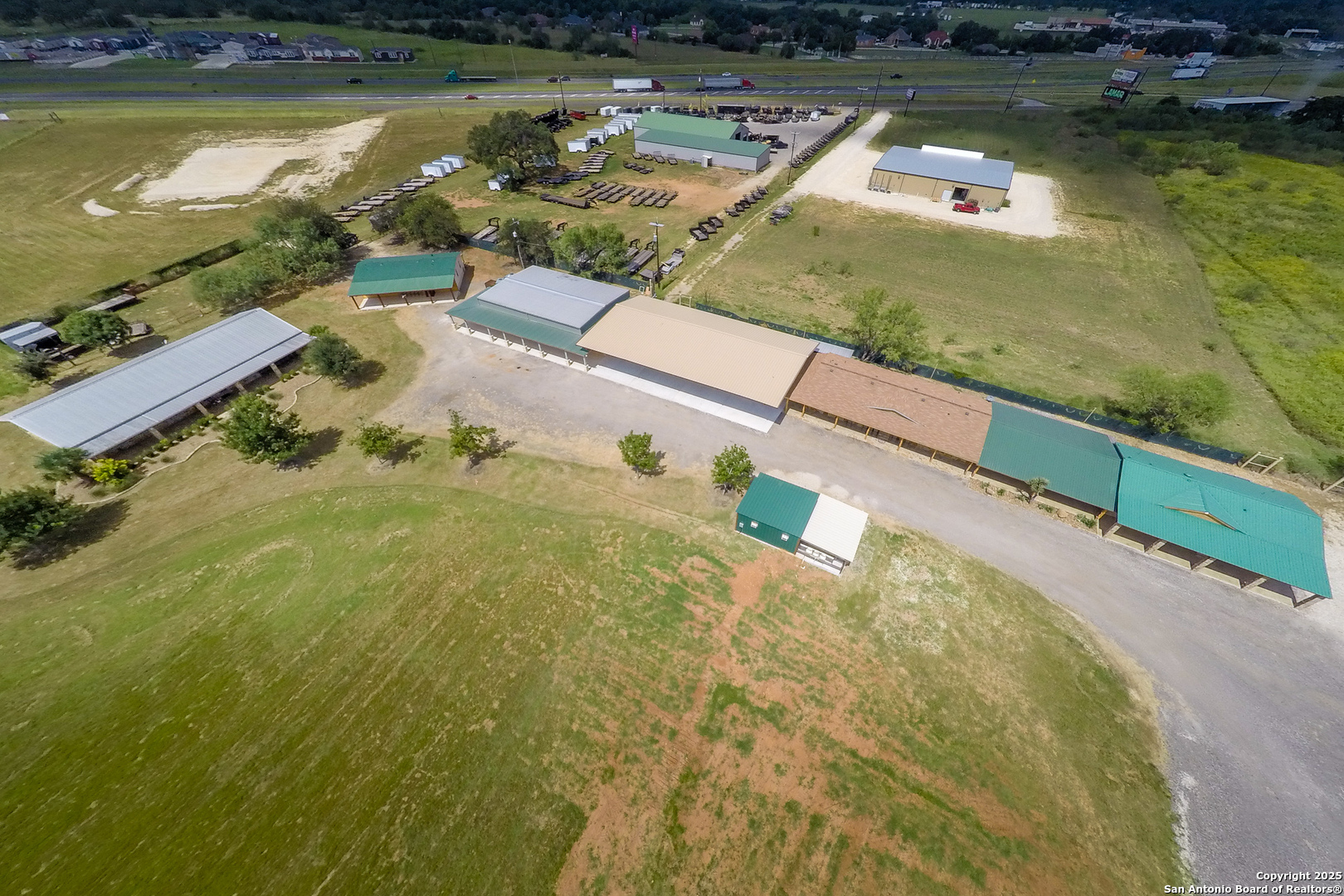 20250 Interstate 35 Access Road Lytle, TX 78052 - Photo 10 of 48 a view of a lake with a house