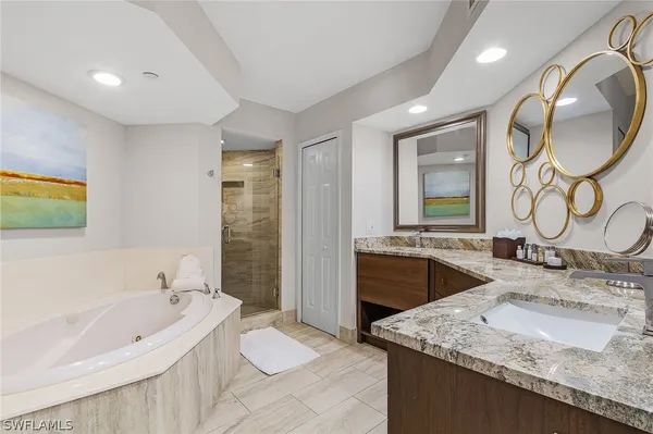 a bathroom with a bathtub and shower