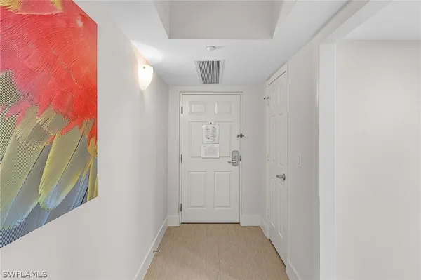 a view of a hallway to a hallway