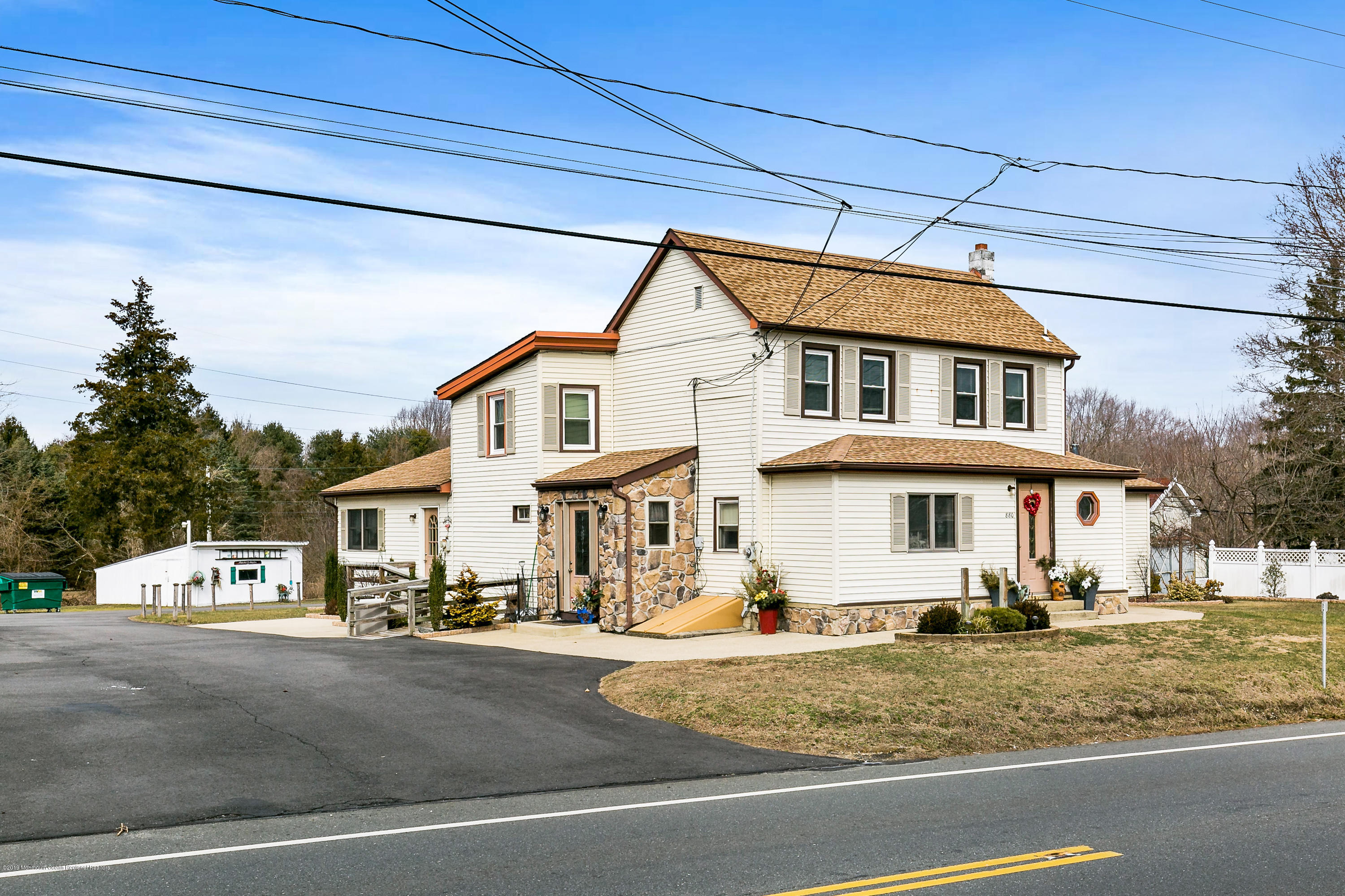 880 Monmouth Road Cream Ridge, NJ 08514 - Photo 1 of 45 a front view of a house with a yard