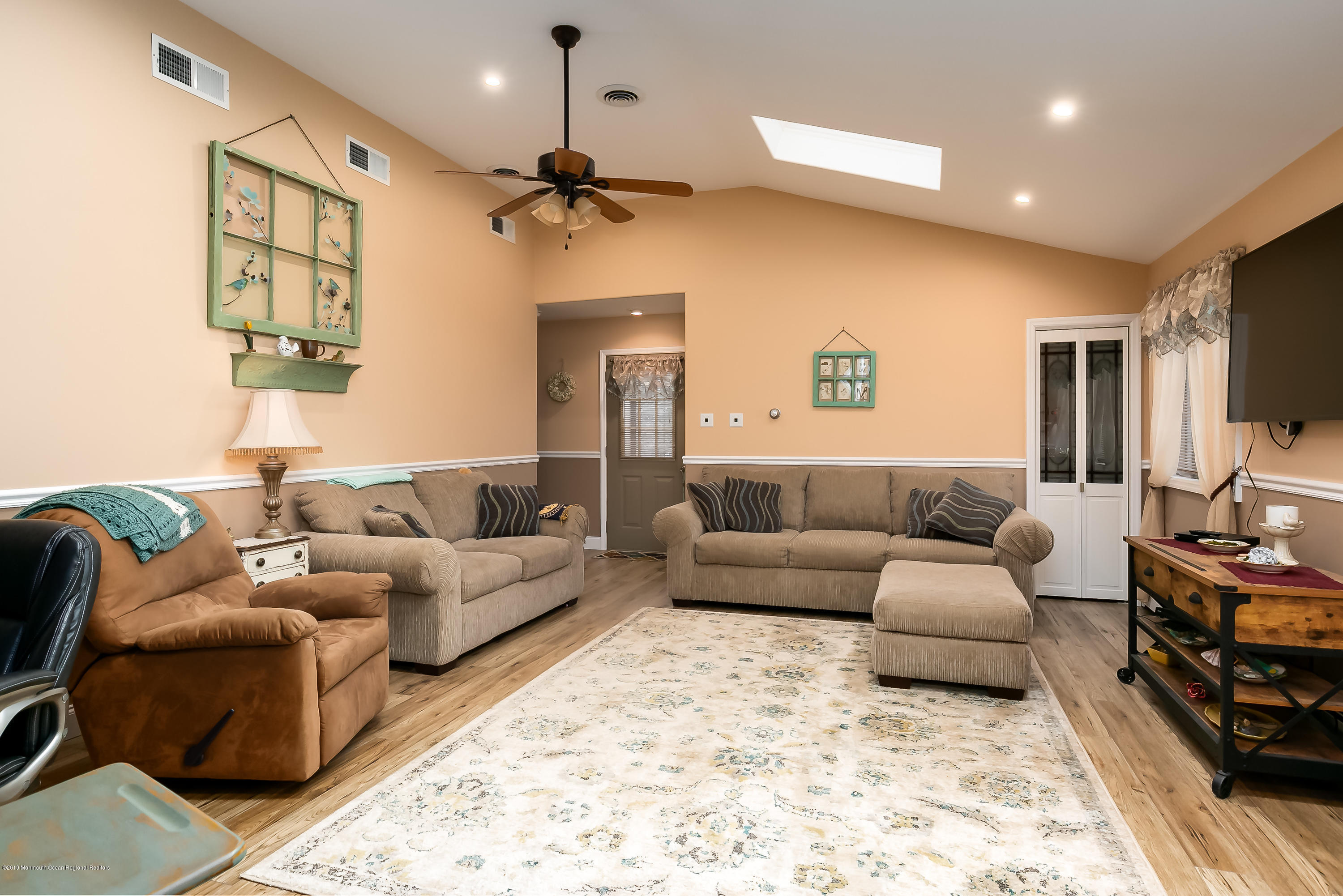 880 Monmouth Road Cream Ridge, NJ 08514 - Photo 15 of 45 a living room with furniture and a flat screen tv