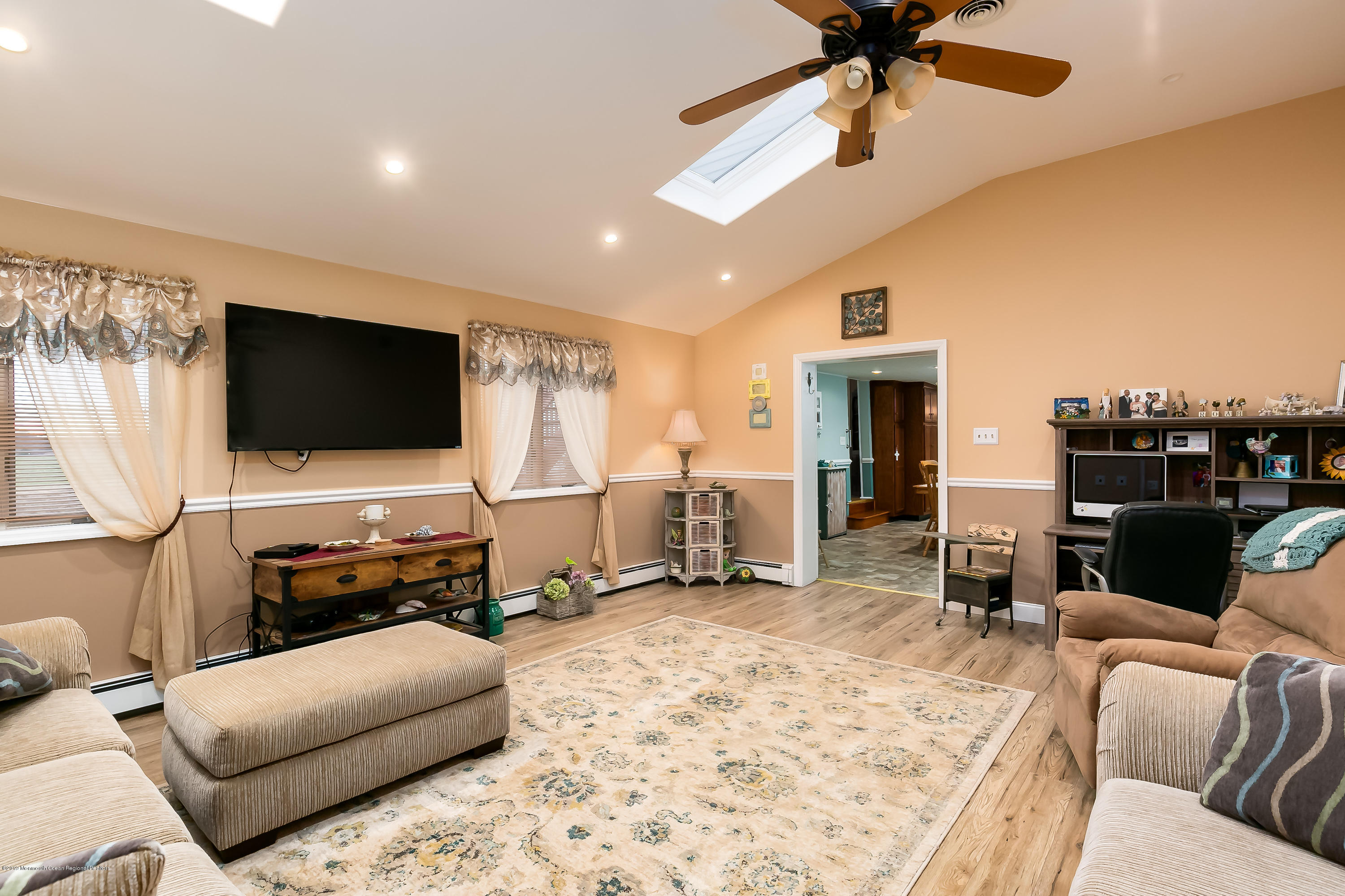 880 Monmouth Road Cream Ridge, NJ 08514 - Photo 16 of 45 a living room with furniture and a flat screen tv
