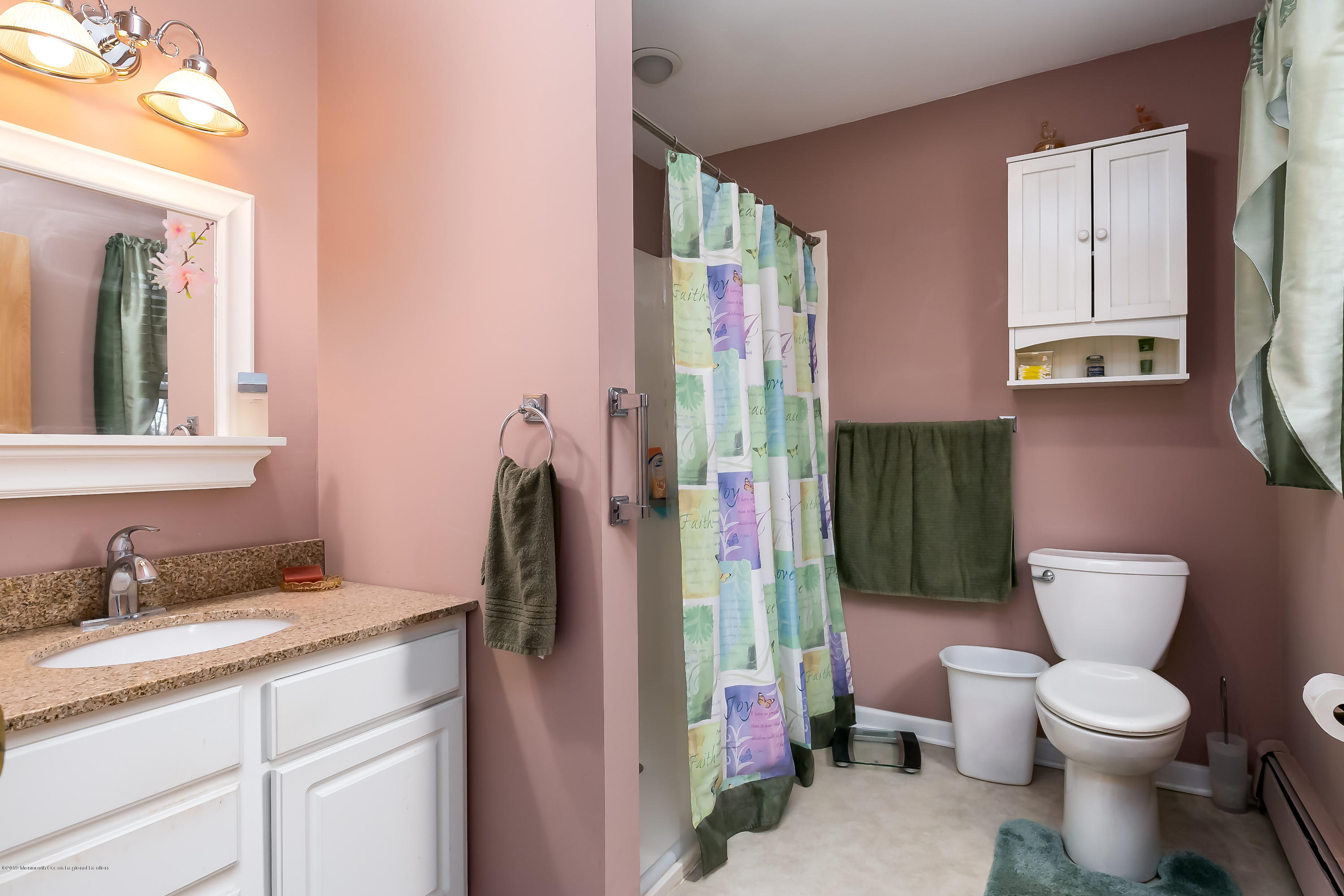 880 Monmouth Road Cream Ridge, NJ 08514 - Photo 21 of 45 a bathroom with a toilet sink and mirror