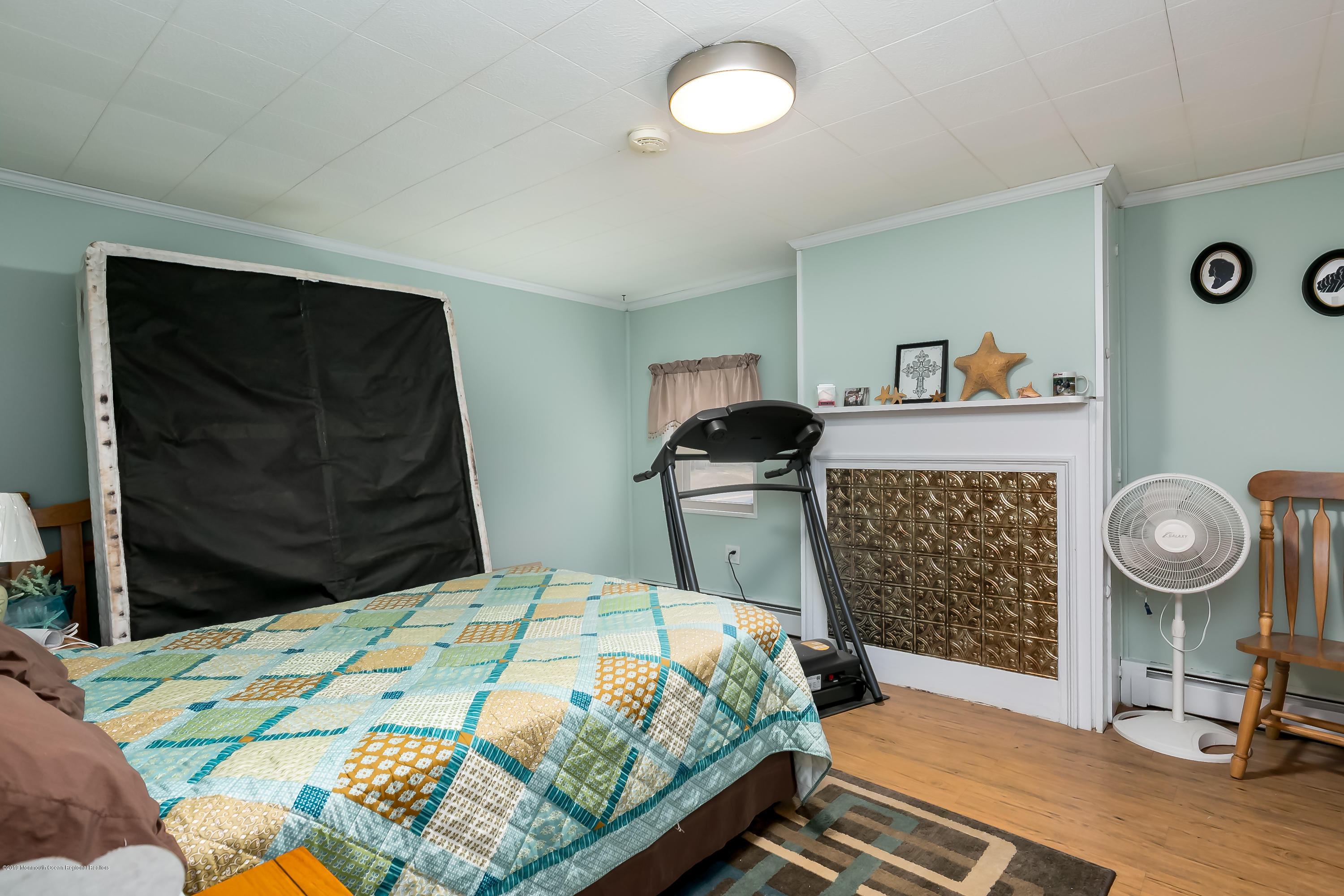 880 Monmouth Road Cream Ridge, NJ 08514 - Photo 23 of 45 a bedroom with a bed and dresser