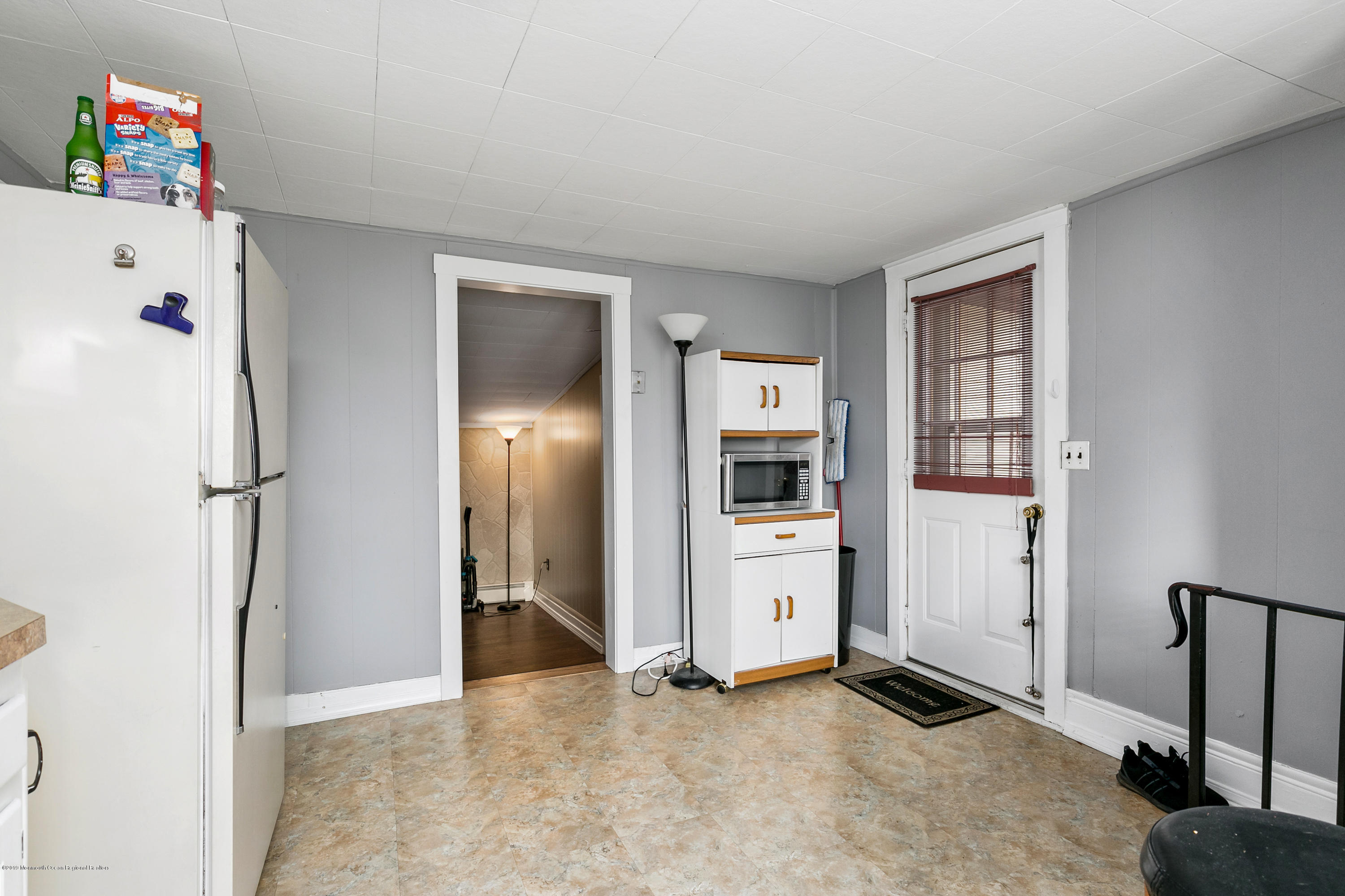 880 Monmouth Road Cream Ridge, NJ 08514 - Photo 28 of 45 a view of kitchen with hallway and refrigerator