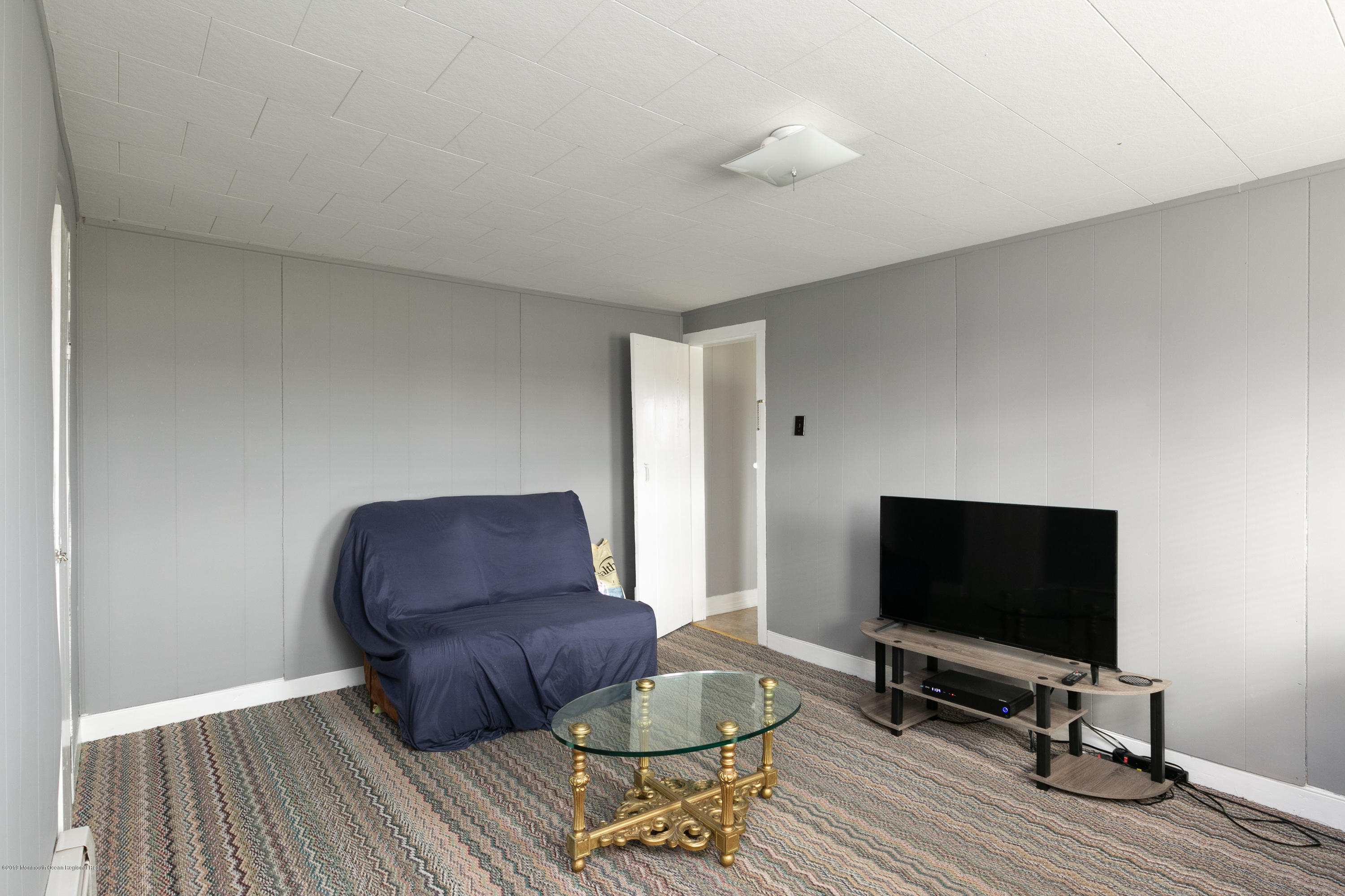 880 Monmouth Road Cream Ridge, NJ 08514 - Photo 30 of 45 a living room with furniture and a flat screen tv