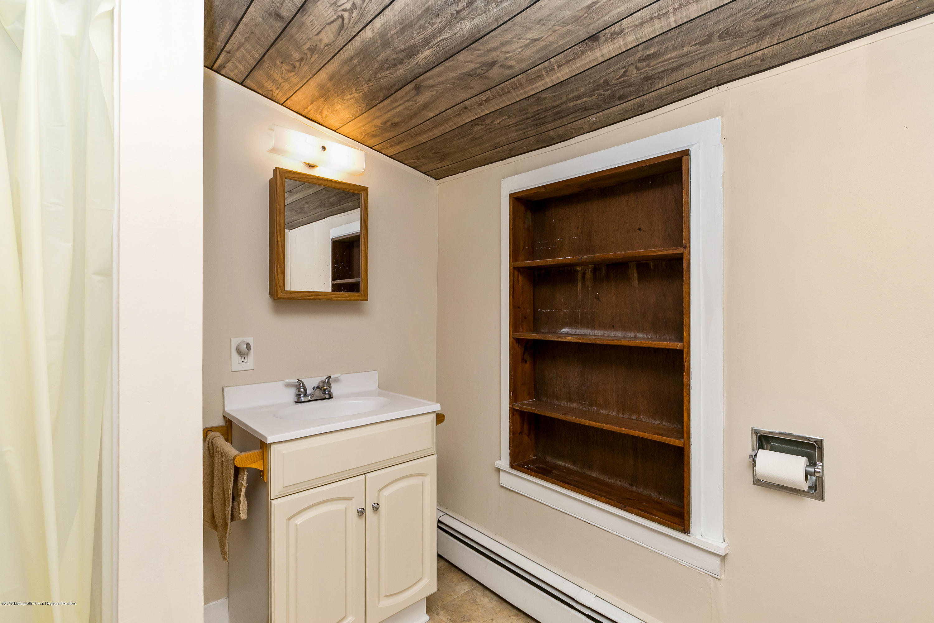 880 Monmouth Road Cream Ridge, NJ 08514 - Photo 33 of 45 a bathroom with a sink and a mirror