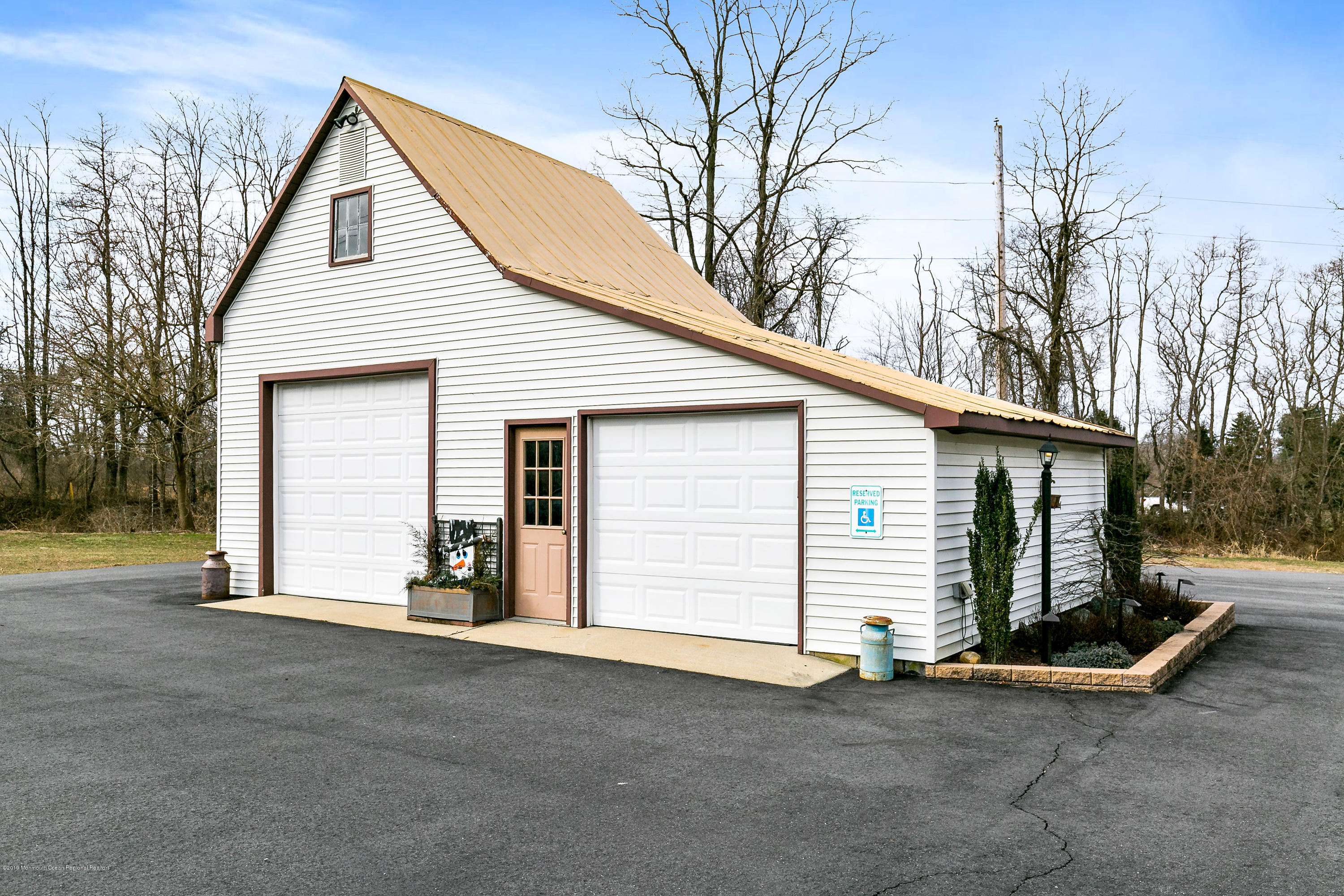 880 Monmouth Road Cream Ridge, NJ 08514 - Photo 44 of 45 a view of a house with a yard and garage