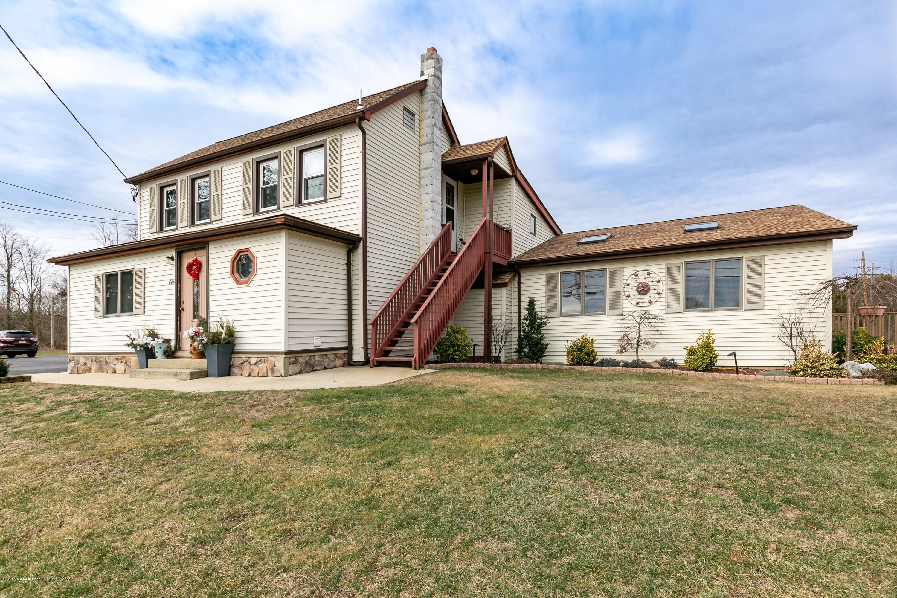 880 Monmouth Road Cream Ridge, NJ 08514 - Photo 6 of 45 a front view of a house with a garden and yard