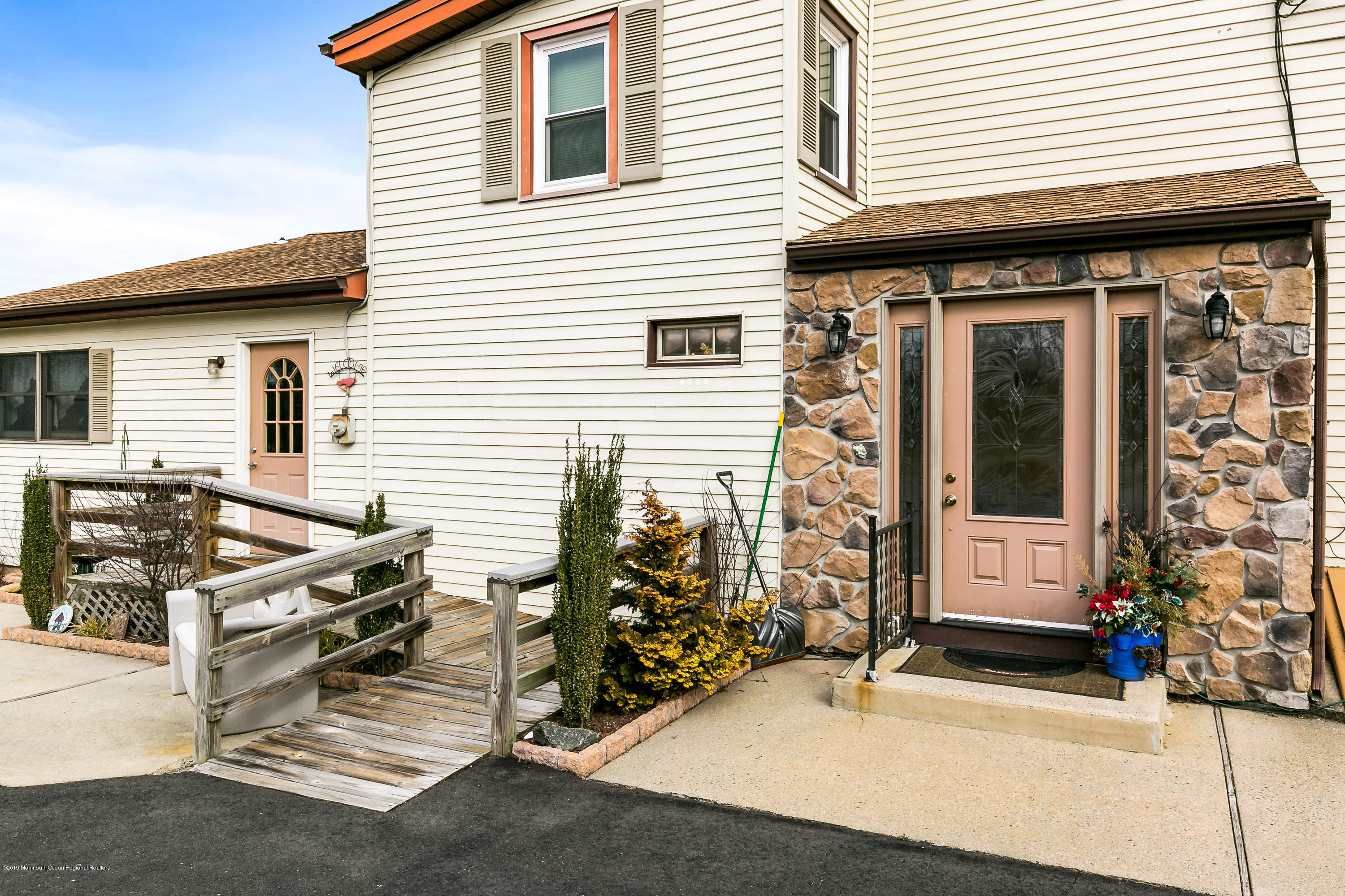 880 Monmouth Road Cream Ridge, NJ 08514 - Photo 7 of 45 a front view of a house with parking