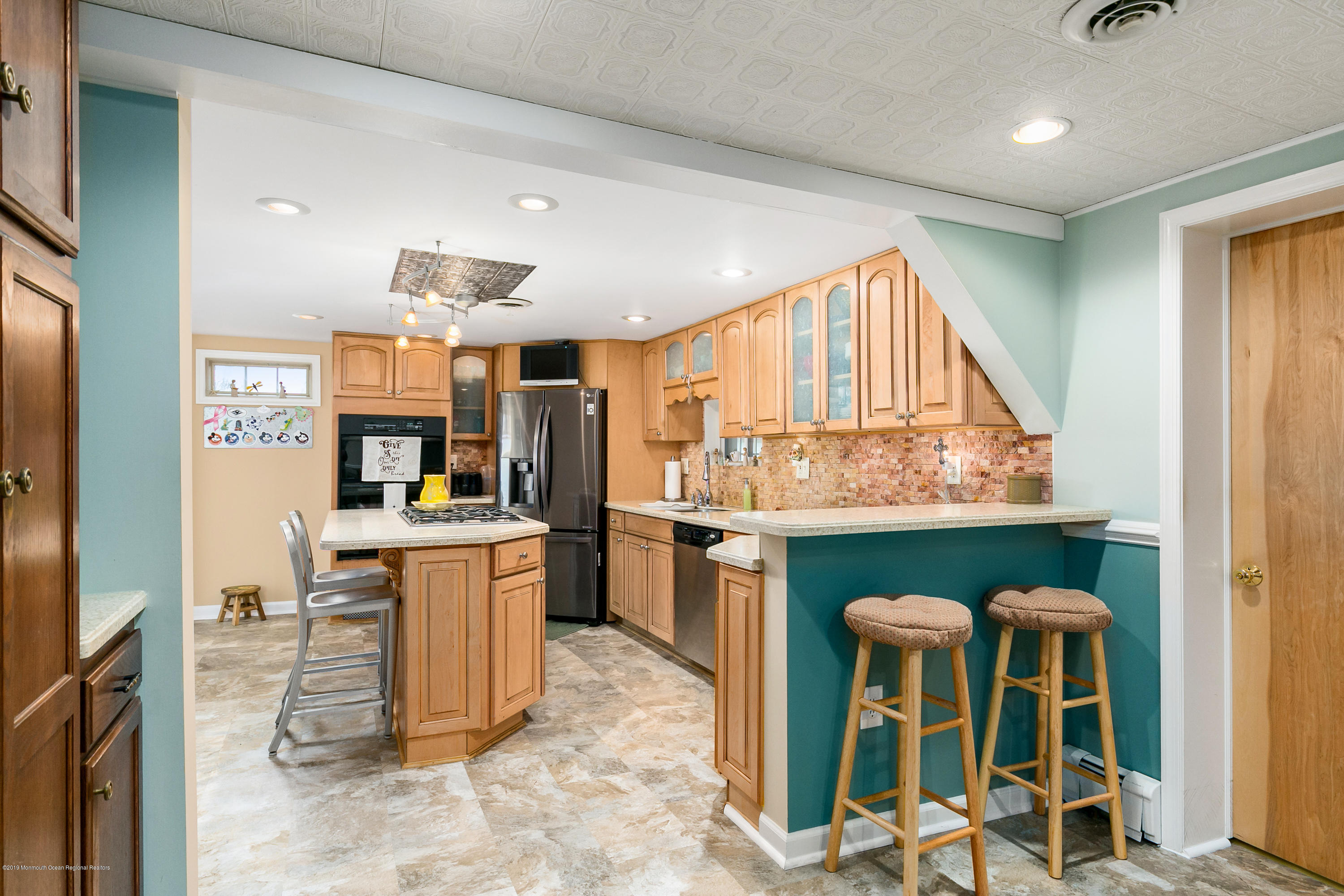 880 Monmouth Road Cream Ridge, NJ 08514 - Photo 9 of 45 a kitchen with kitchen island a table and chairs in it