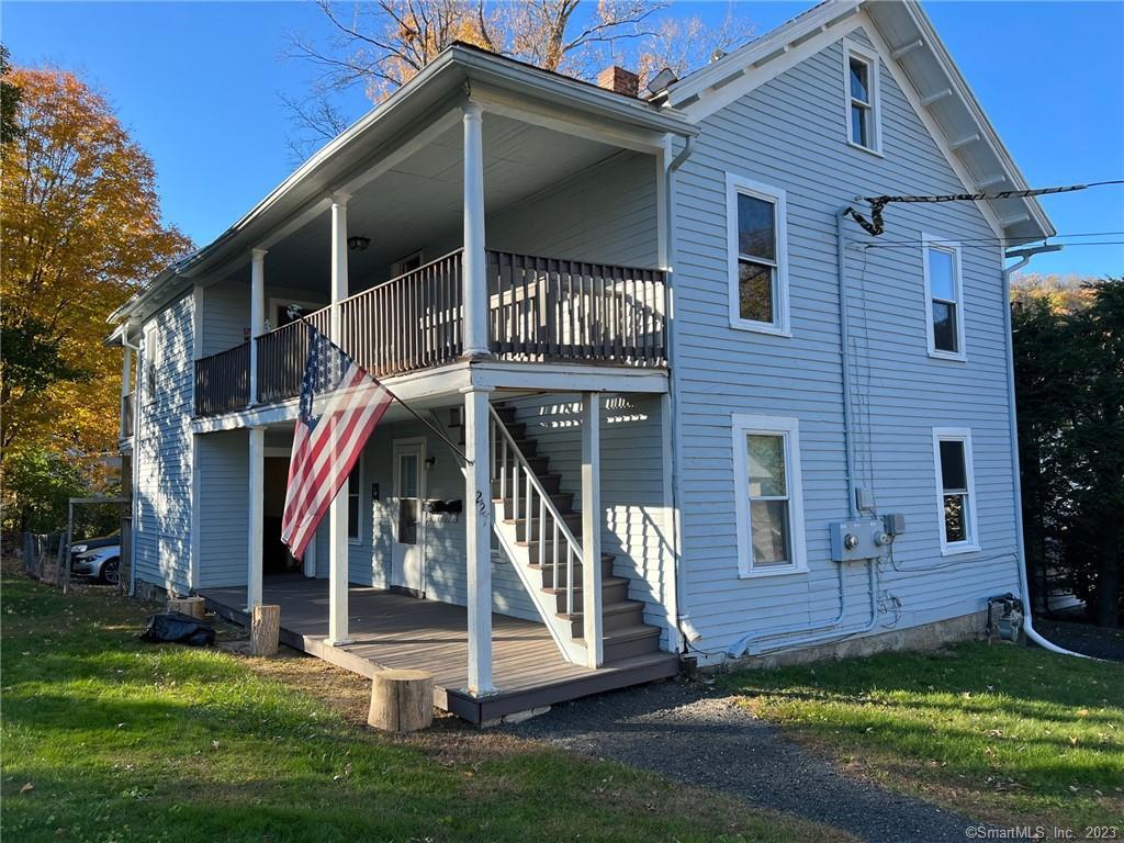 227 Walnut Street, Unit 1 Winchester, CT 06098 - Photo 1 of 1 a front view of a house with a yard