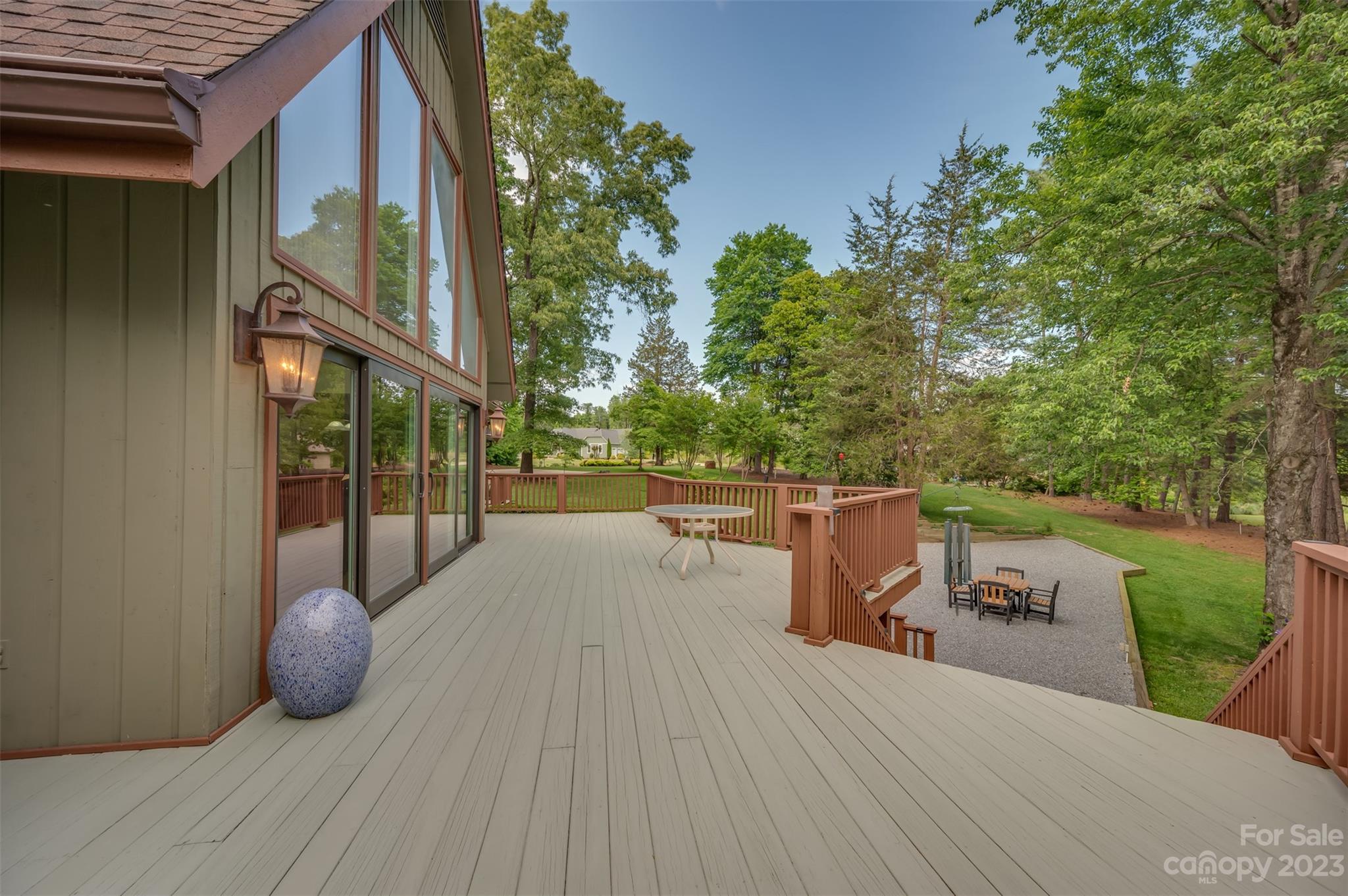 900 Club Road Tryon, NC 28782 - Photo 15 of 48 a view of a deck with couches and wooden floor