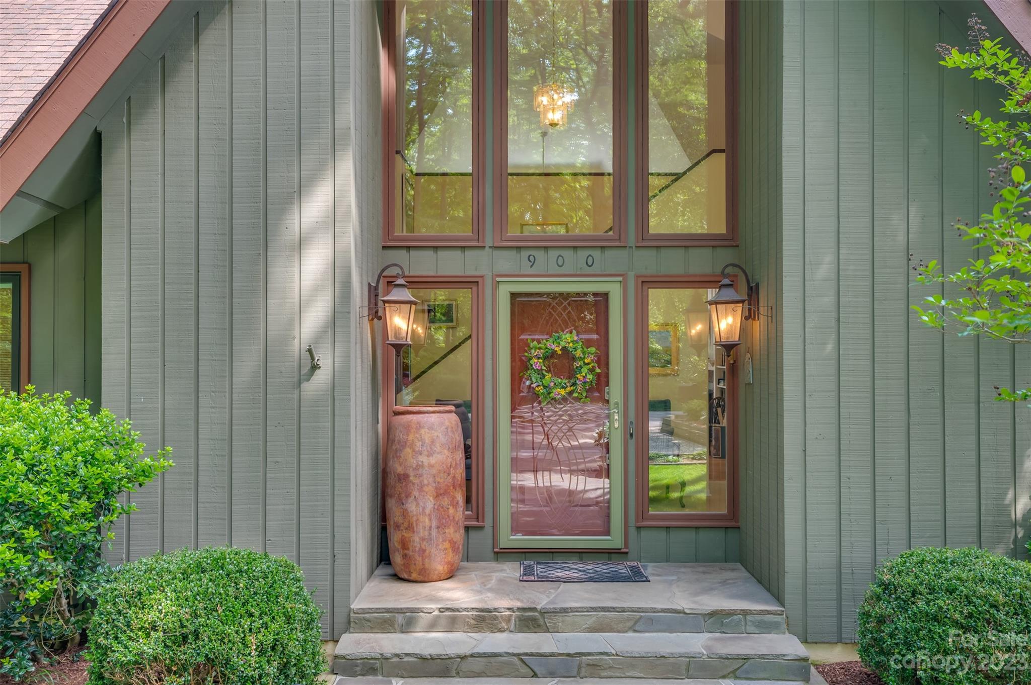 900 Club Road Tryon, NC 28782 - Photo 2 of 48 a front view of a house with a plants