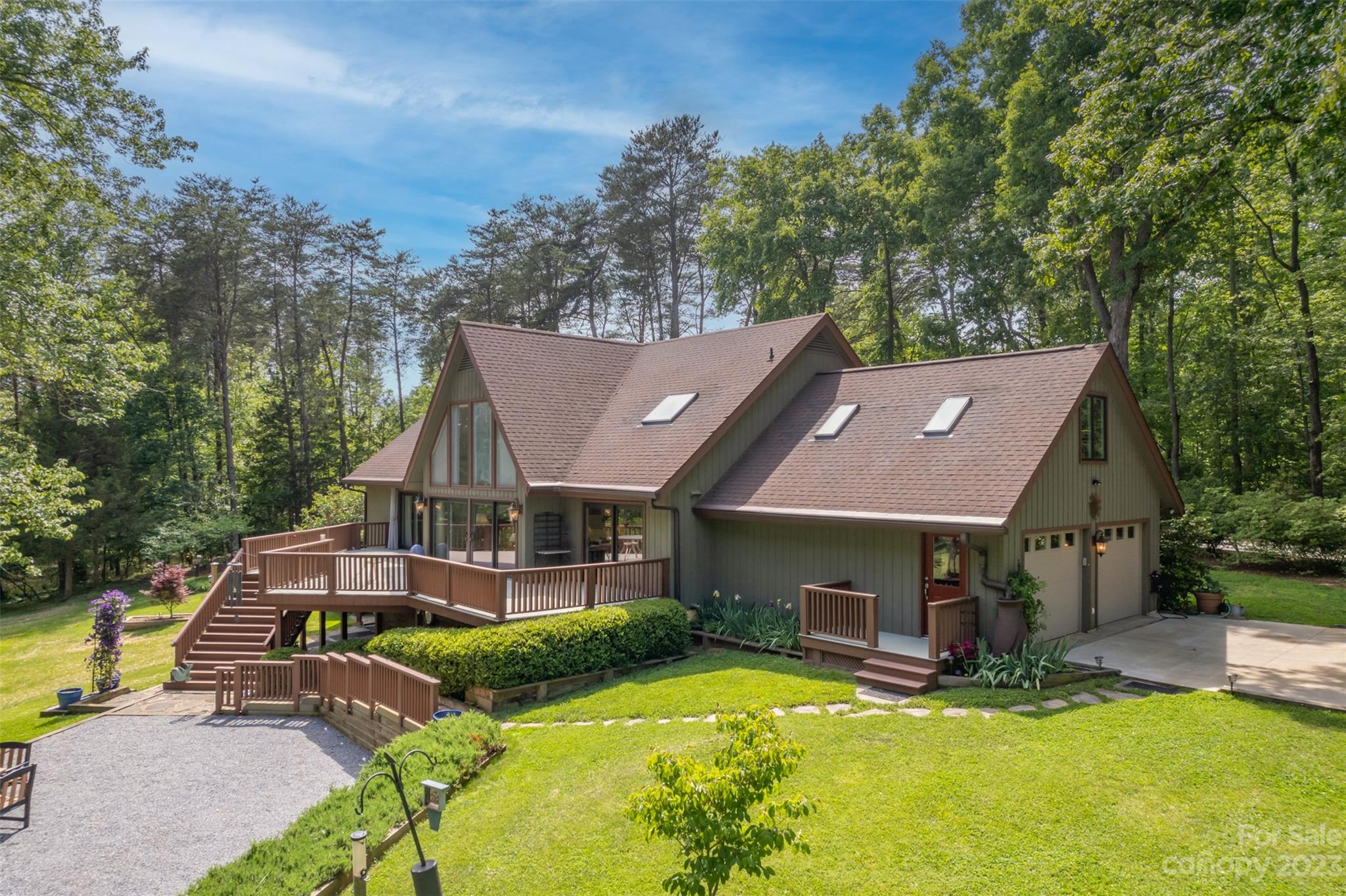 900 Club Road Tryon, NC 28782 - Photo 3 of 48 a view of a house with swimming pool and sitting area