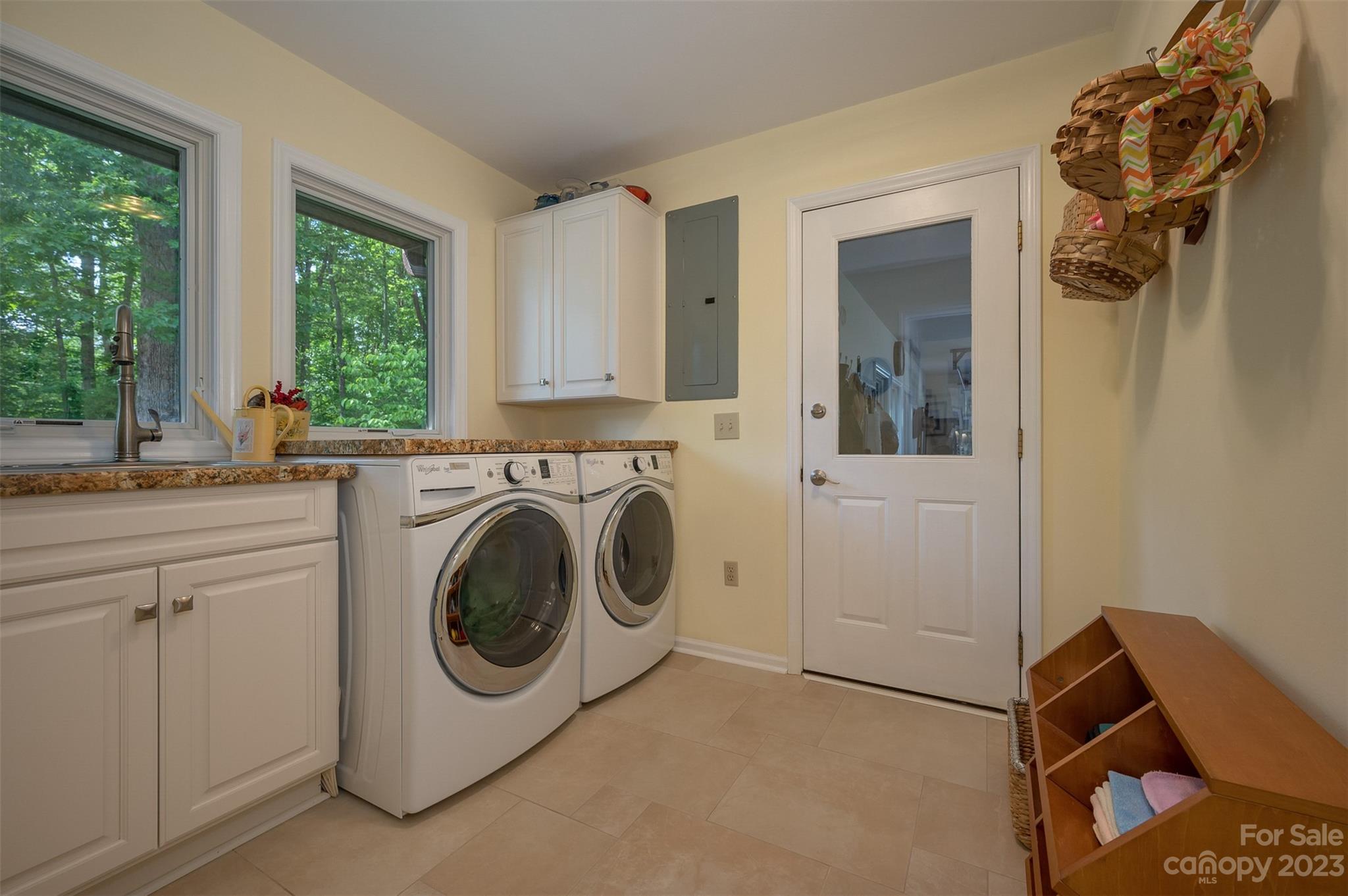 900 Club Road Tryon, NC 28782 - Photo 32 of 48 a utility room with sink dryer and washer