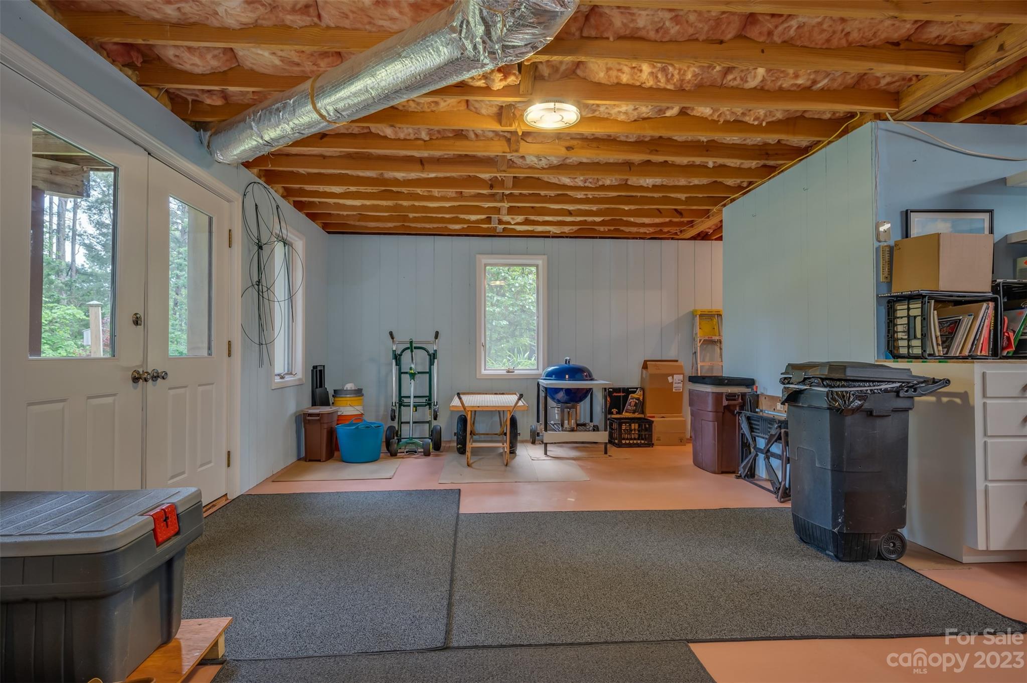 900 Club Road Tryon, NC 28782 - Photo 33 of 48 a outdoor space with lots of tables a chair and potted plants