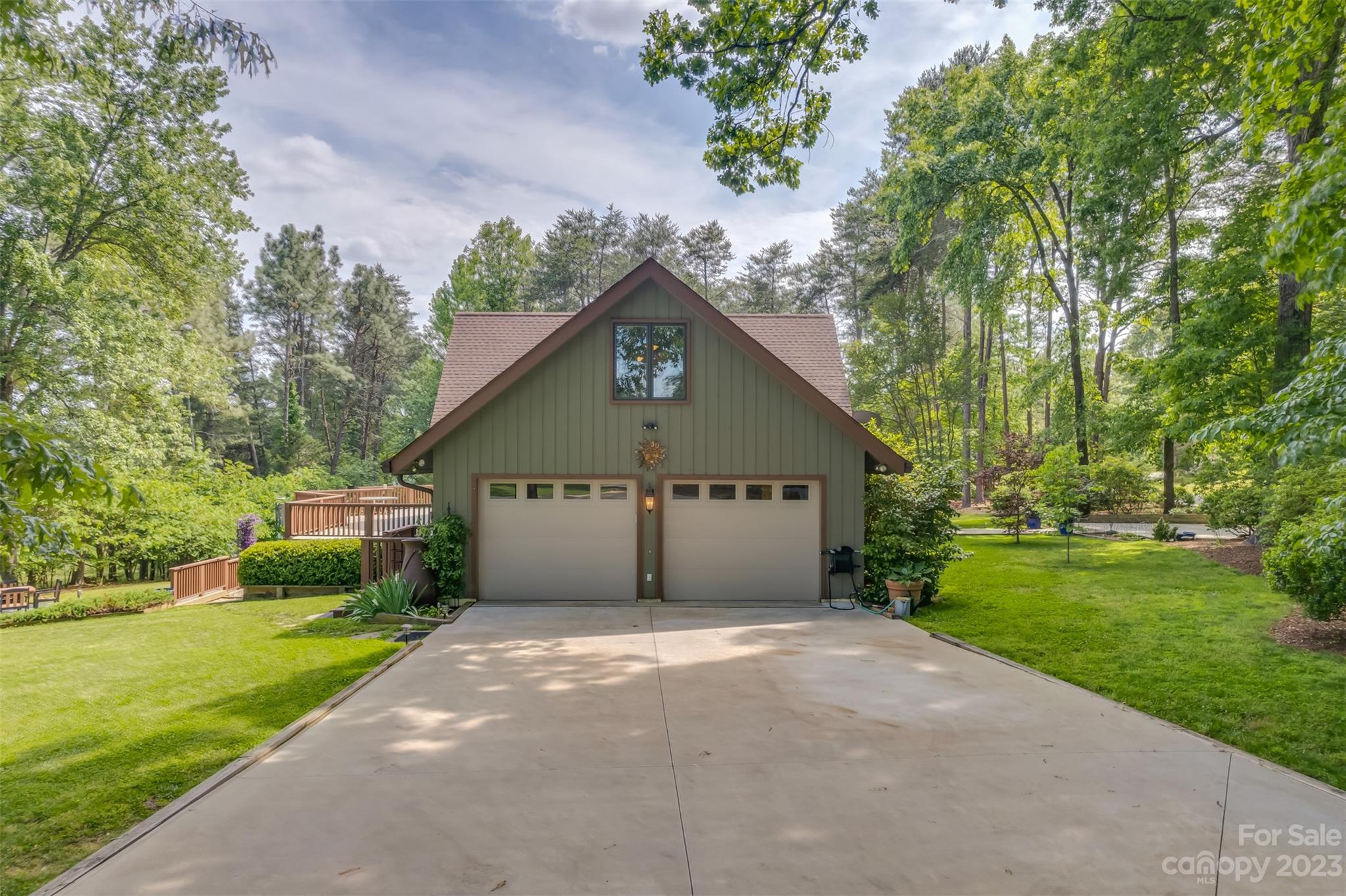 900 Club Road Tryon, NC 28782 - Photo 41 of 48 a front view of a house with a garden